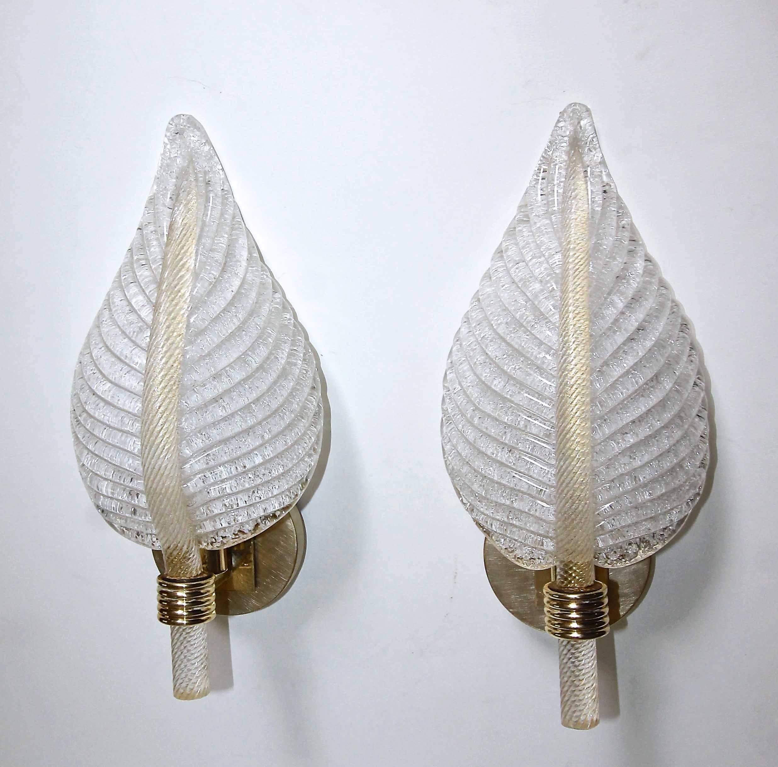 Beautiful pair of Murano glass wall sconces in plume or leaf shape form by Barovier & Toso. Finely twisted glass stem infused with gold flecks and the reverse side of the leaf in the 