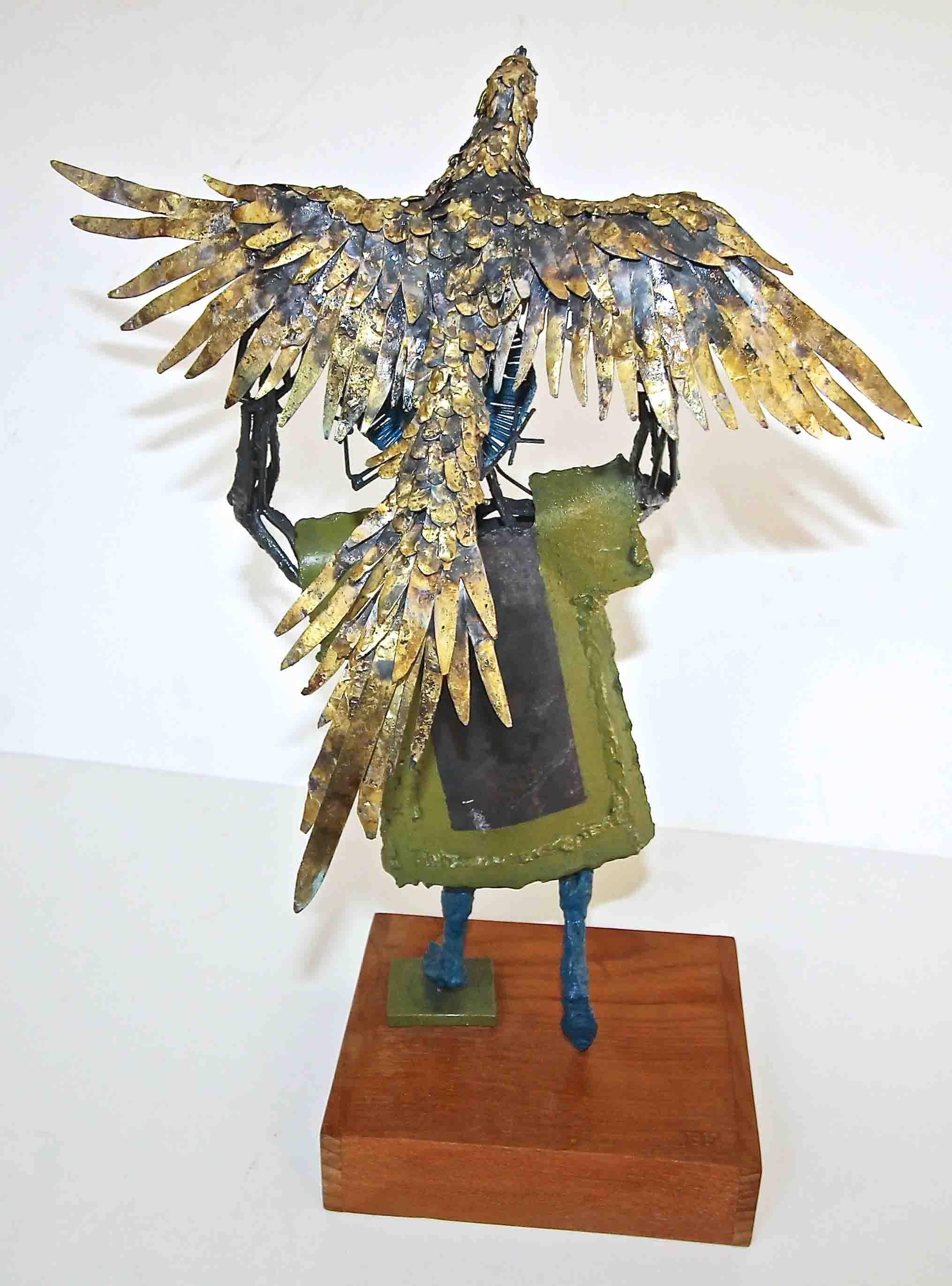 bird holding up man statue