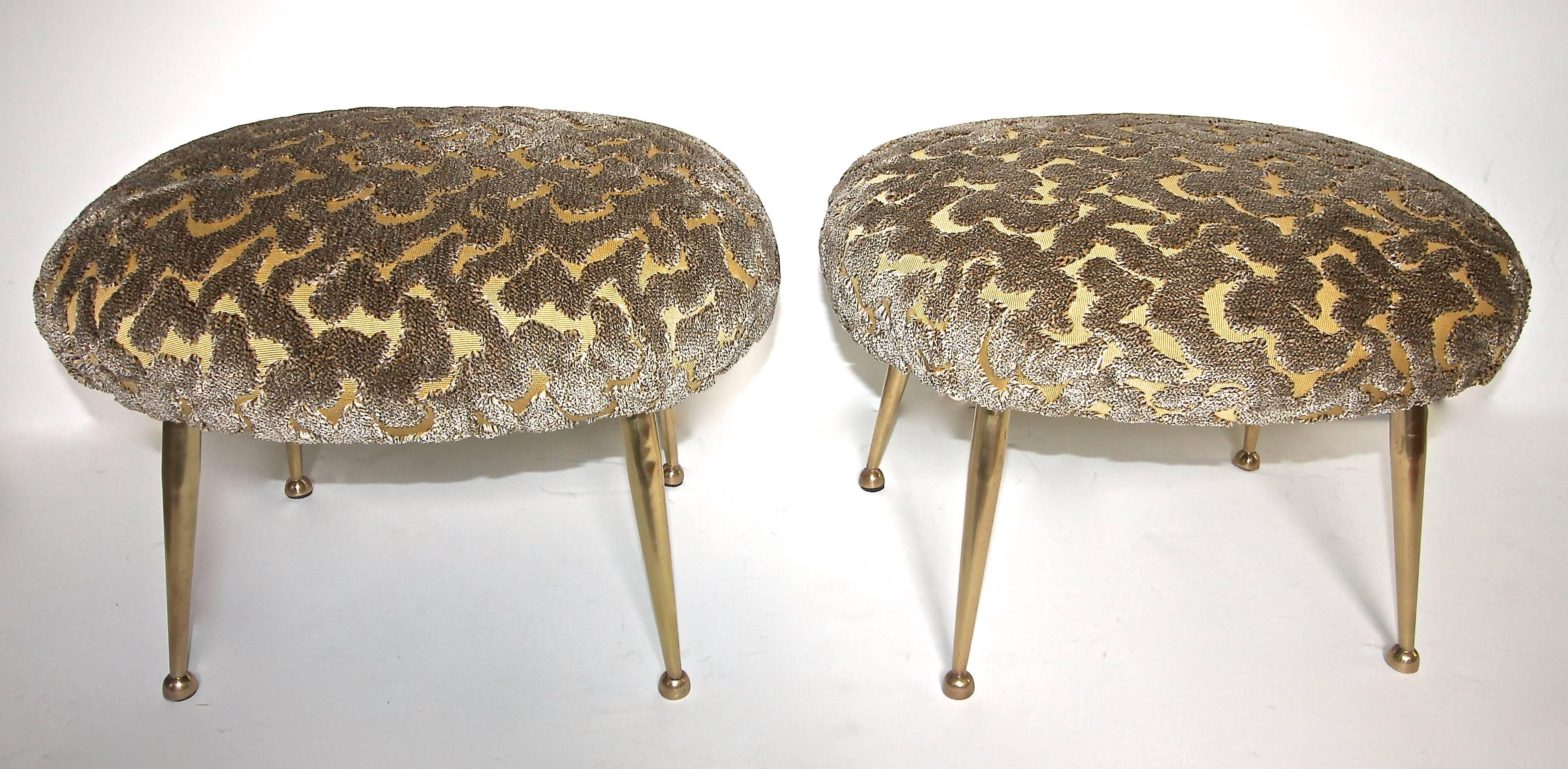 Pair of Italian upholstered brass leg footstools, attributed to Gigi Radice. Smaller scale and height. Newly covered in an Ardecora cut velvet fabric.