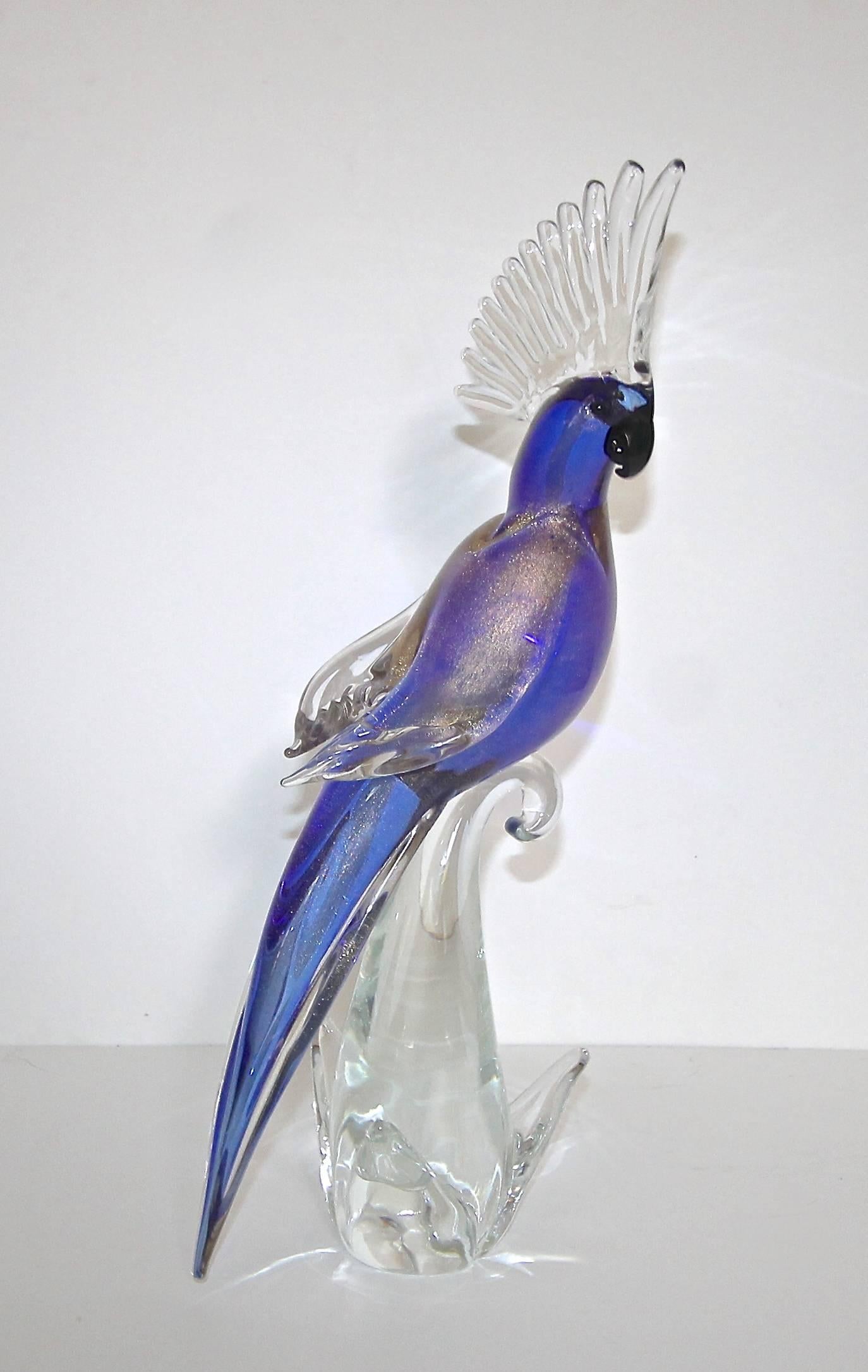 Large Italian Murano handblown glass cockatoo in clear and vibrant blues and soft purples with gold inclusions on wings. Beautifully crafted.