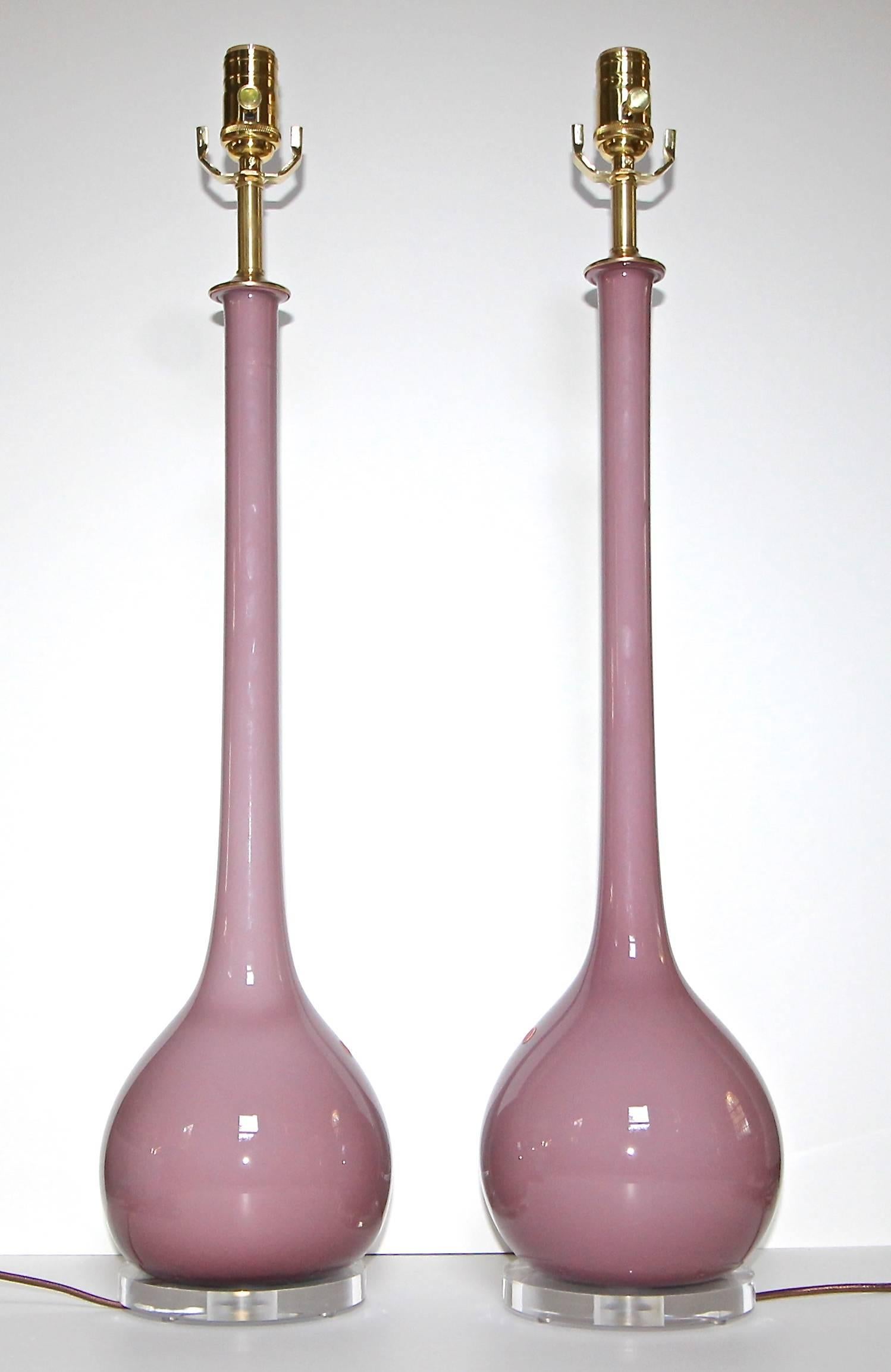 Pair of Murano lavender purple or plum cased blown glass table lamps with tall necks. Newly wired for US with custom acrylic bases, brass fittings, full range dimmer sockets and brown rayon covered cords. 

Height of glass from base to top of glass