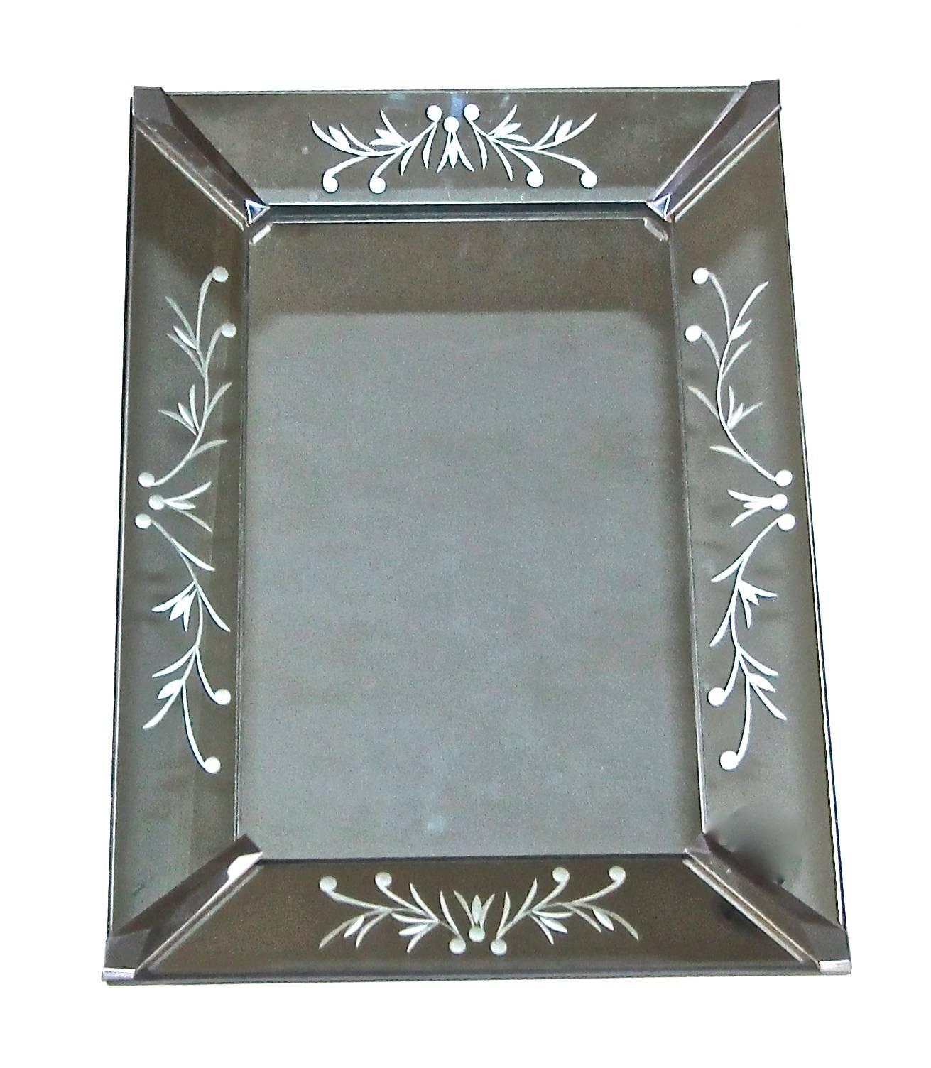 Smaller scale rectangular French deco style wall mirror with chrome corners and reverse etched mirrored panels. Perfect scale for powder room.