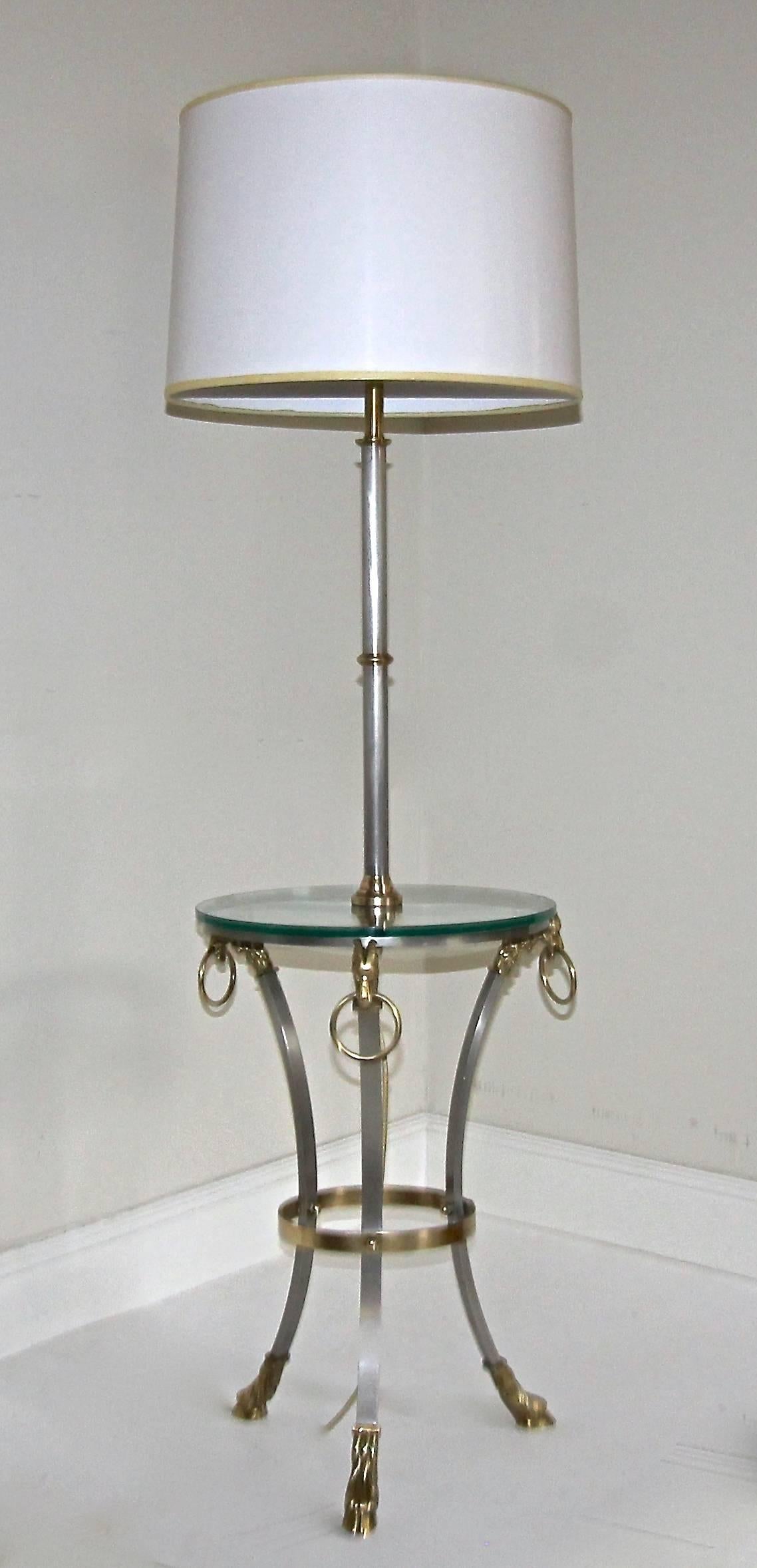 Beautiful Maison Jansen style brass and steel lamp side table with glass top and ram's head and hoof feet motif brass detailing. Newly wired. Shade not included and shown for photography purposes only.
