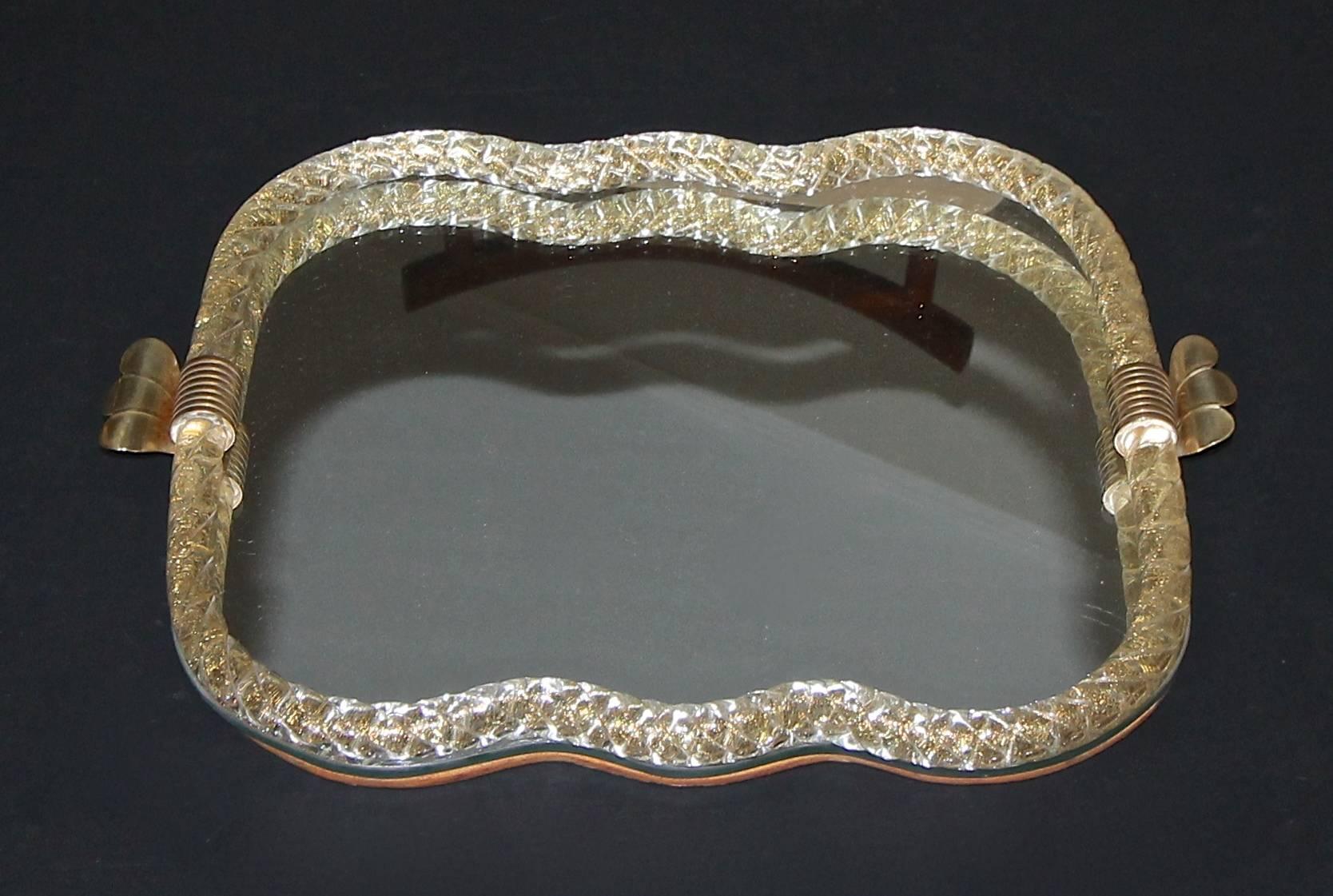 Murano glass tray with finely twisted glass rope border with gold inclusions and brass fittings. 

Tray size 15.25