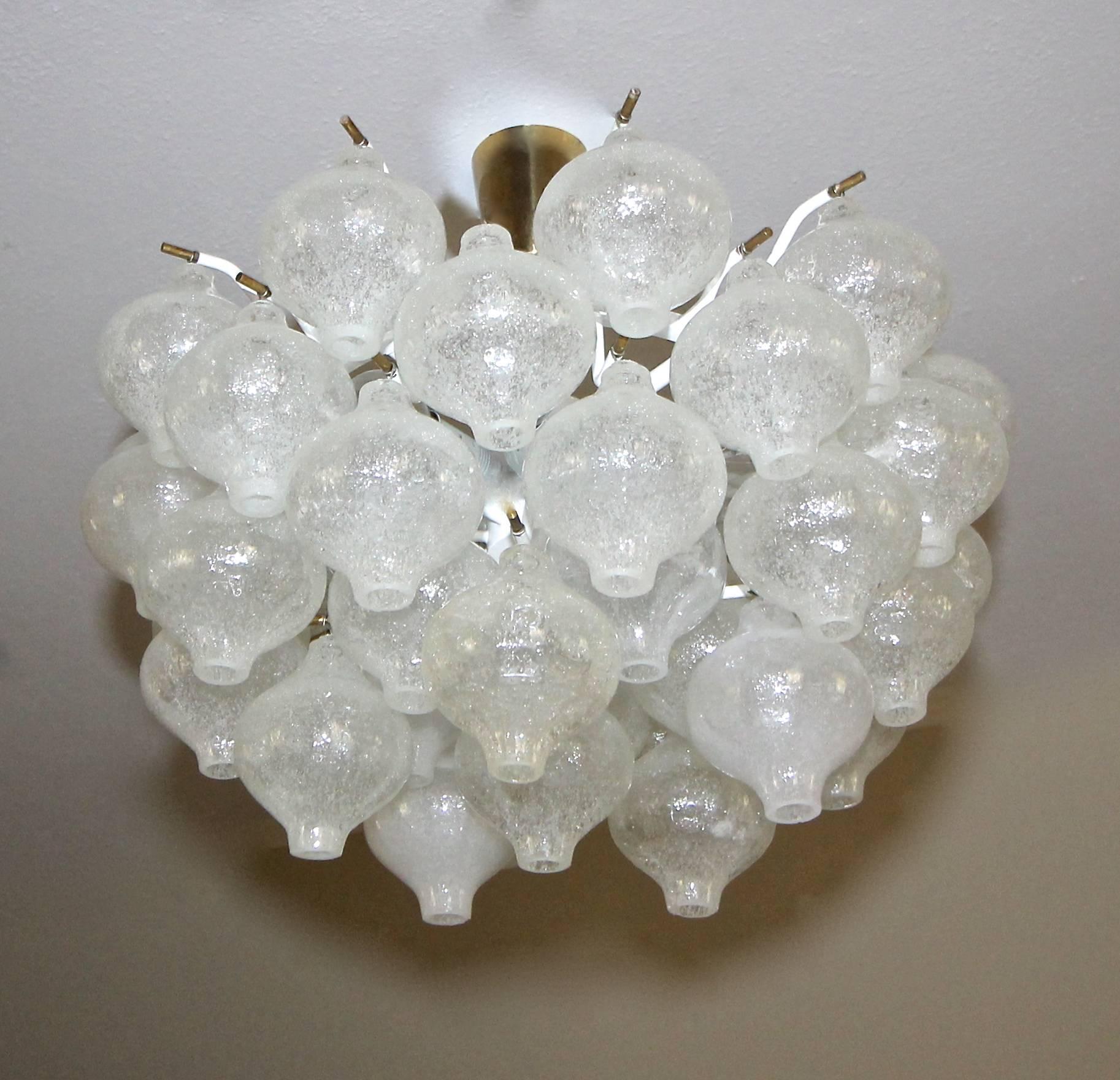 Beautiful Tulipan glass chandelier by J.T. Kalmar. Onion shaped blown glass elements in the puleguso style are infused with bubbles and suspended on a white painted metal frame. Brass centre rod, ceiling cap and fittings. Fixture is newly wired for