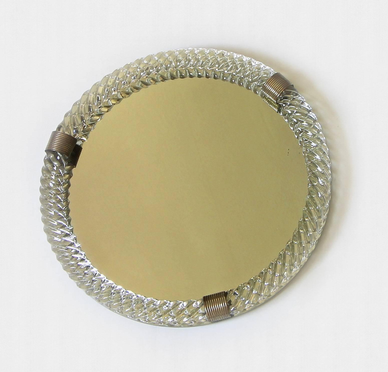 Large round circular mirrored Murano glass vanity tray surmounted by thick finely twisted blown glass with brass straps in the style of Venini.