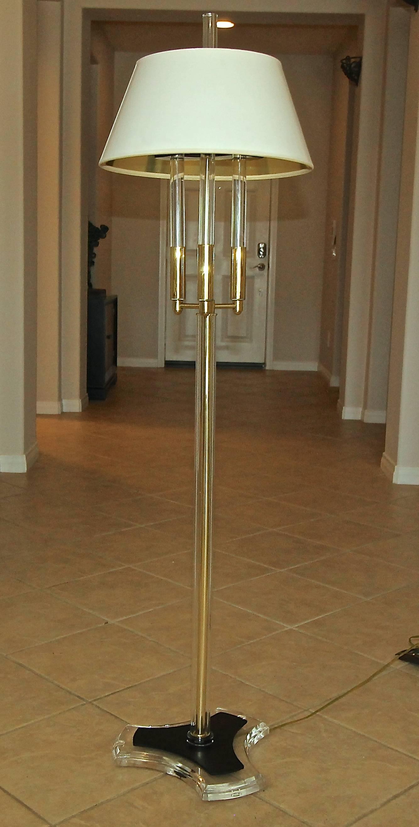 Modern brass and acrylic floor lamp. Uses two regular A base bulbs with on/off switch on cord. Nicely detailed with dark acrylic accents and decorative brass arms with clear acrylic stems. Shade not included for photography purposes only.