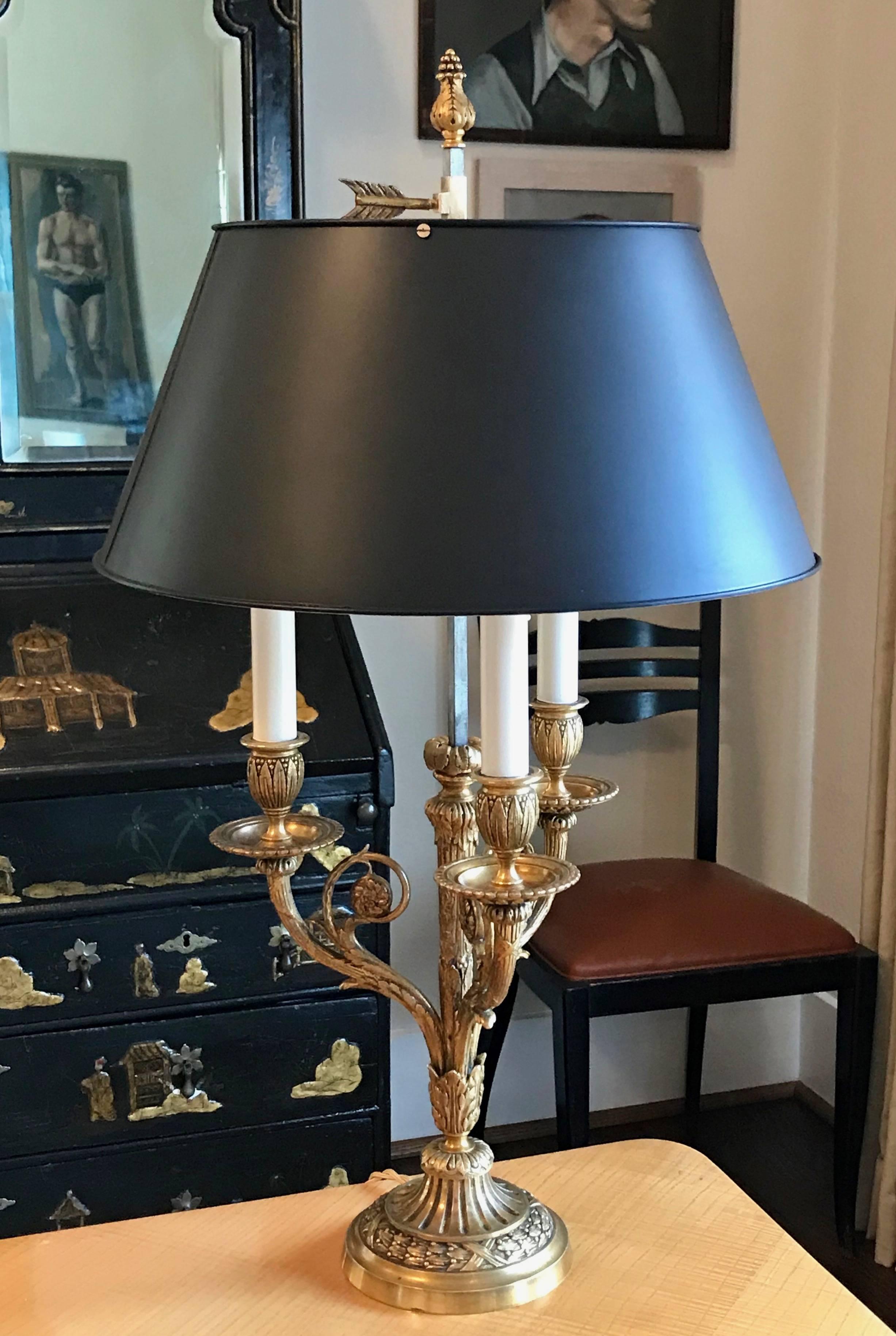 Doré gilt bronze Bouillotte lamp by the French manufacturer, Fumiere et Cie. Three arms with beautifully cast and chased classical details. Newly rewired for the US with a French style twisted rayon covered cord and thumb turn on/off switch.