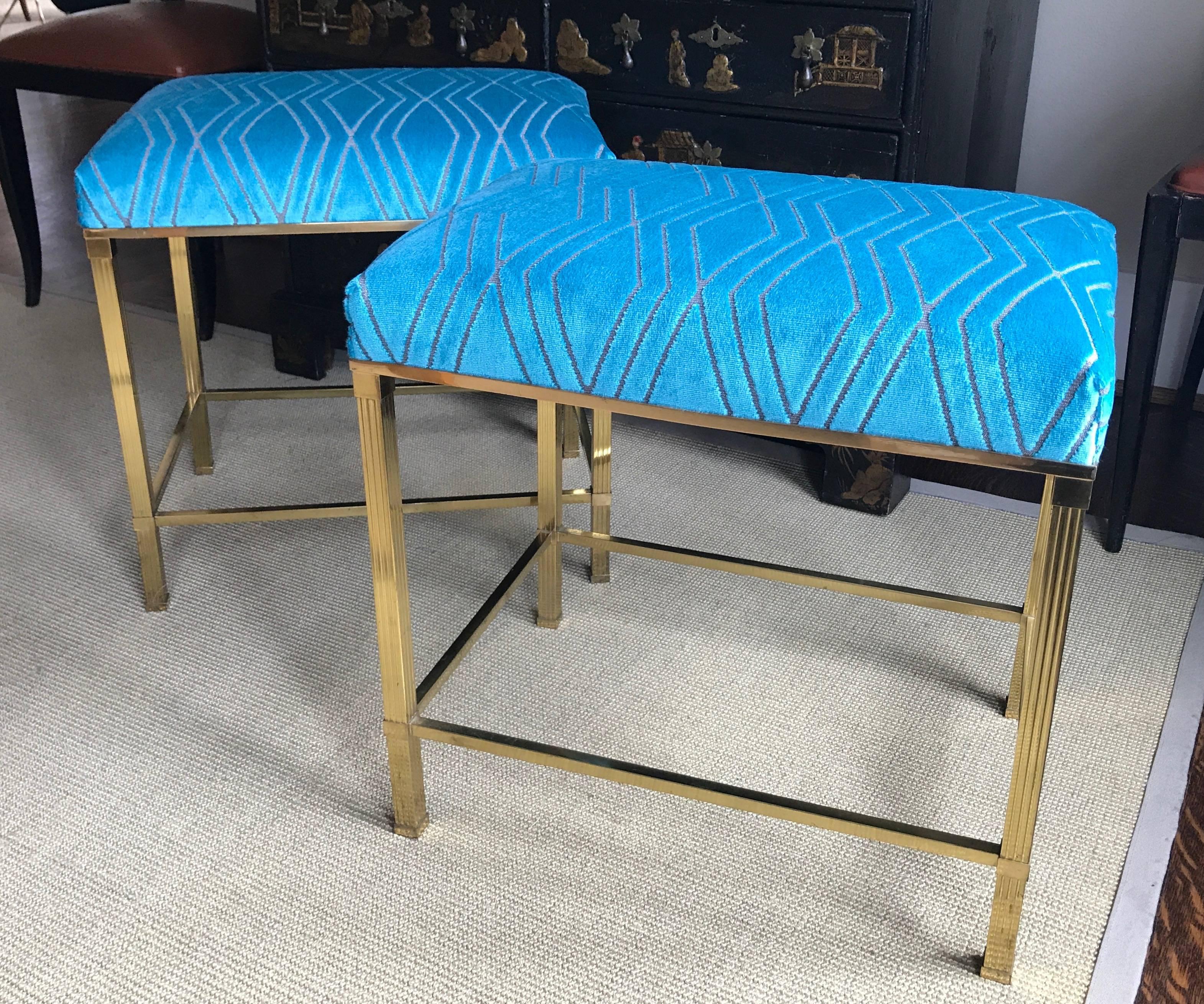 Pair of clean lined brass benches in the French modernist style. Nice reeded leg detailing with upholstered tops. In the manner of Edward Wormley for Dunbar. Newly upholstered in a high quality cut velvet in a vibrant aqua color.

Measures: