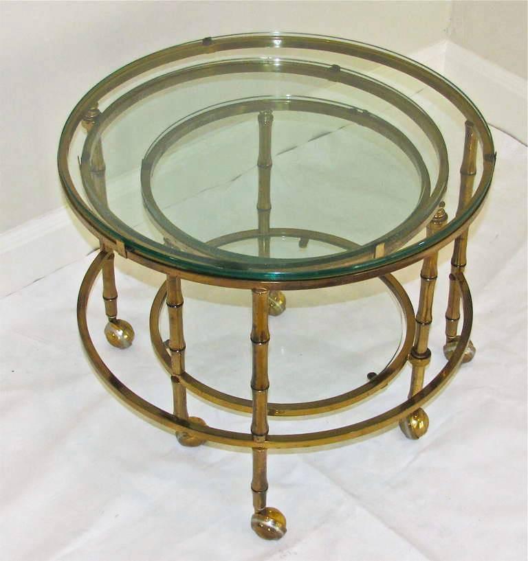 Exceptional 3 tier glass inset swivel extending faux bamboo cocktail coffee table on castors. Folded size 22
