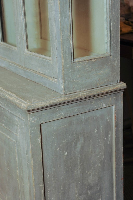 A pair of French grey/green patinated bookcases in 2 parts.