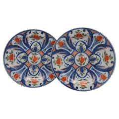 Delft - Pair of blue, green and orange plates by 'De Paauw' - 18th century