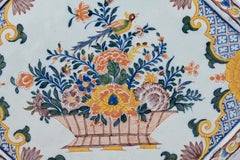 Polychrome Delftware Wall Plaque with Bird and Flower Basket, Delft, circa 1750