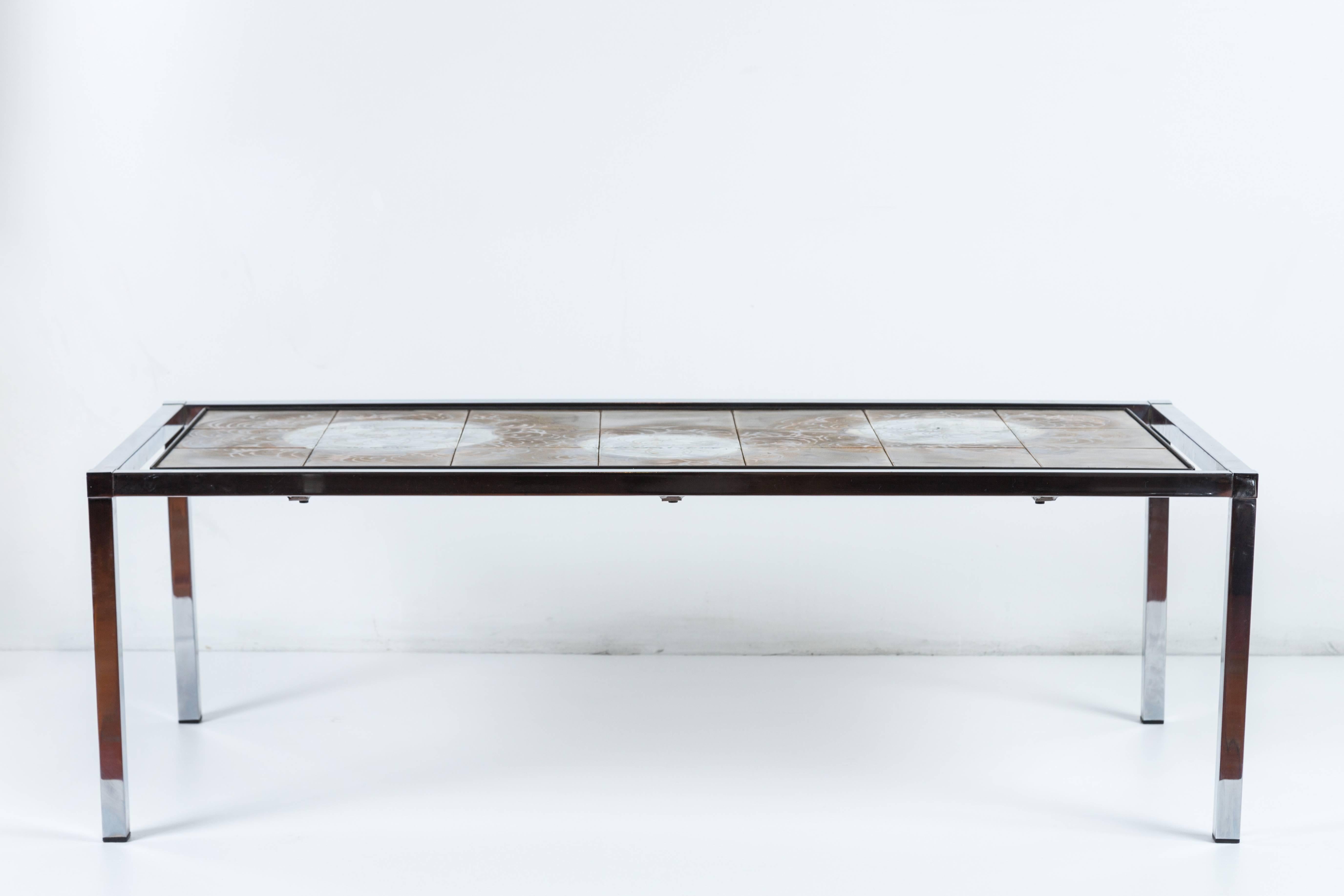 Signed ceramic and chrome coffee table.