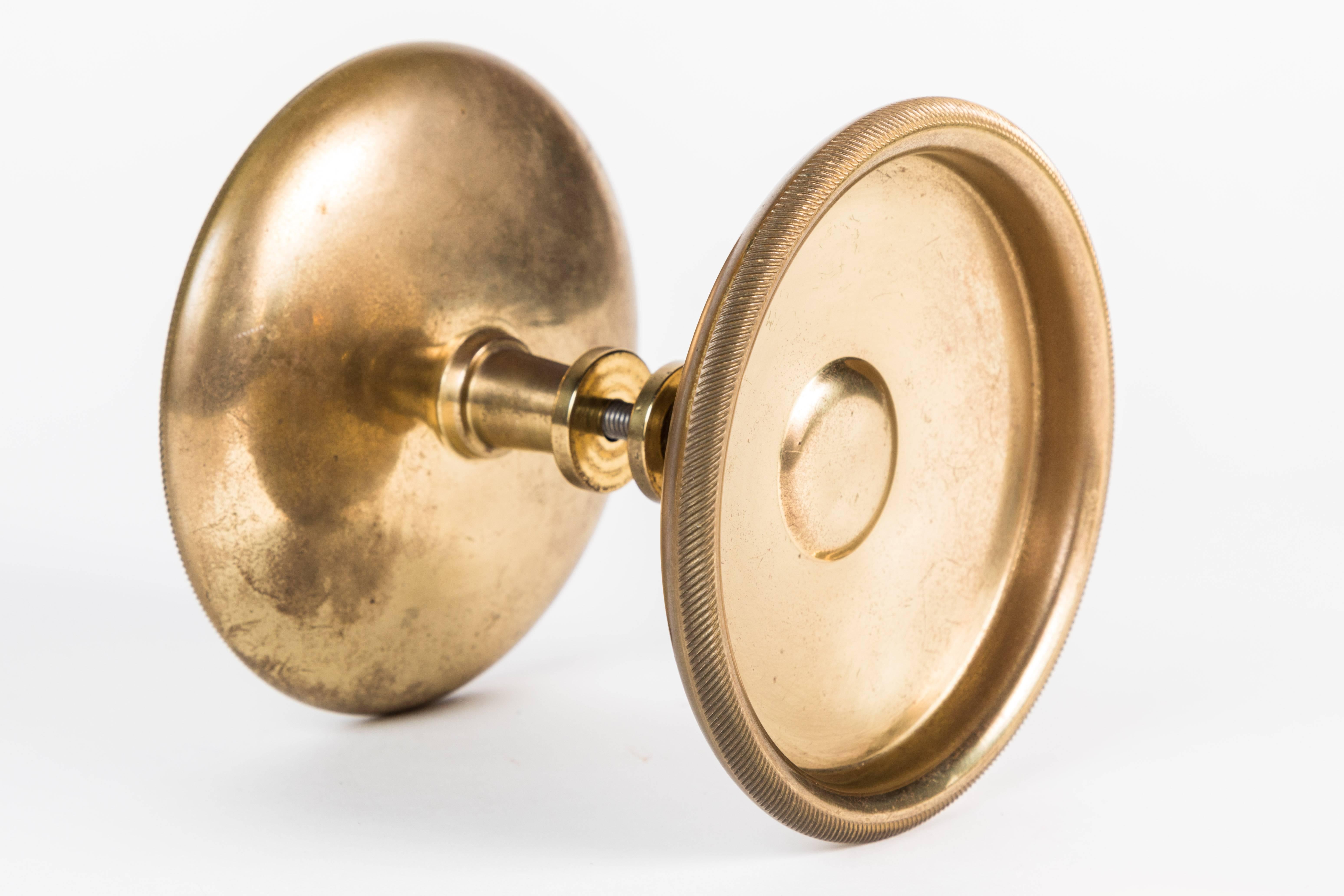 Set of two heavy Italian brass doorknobs.