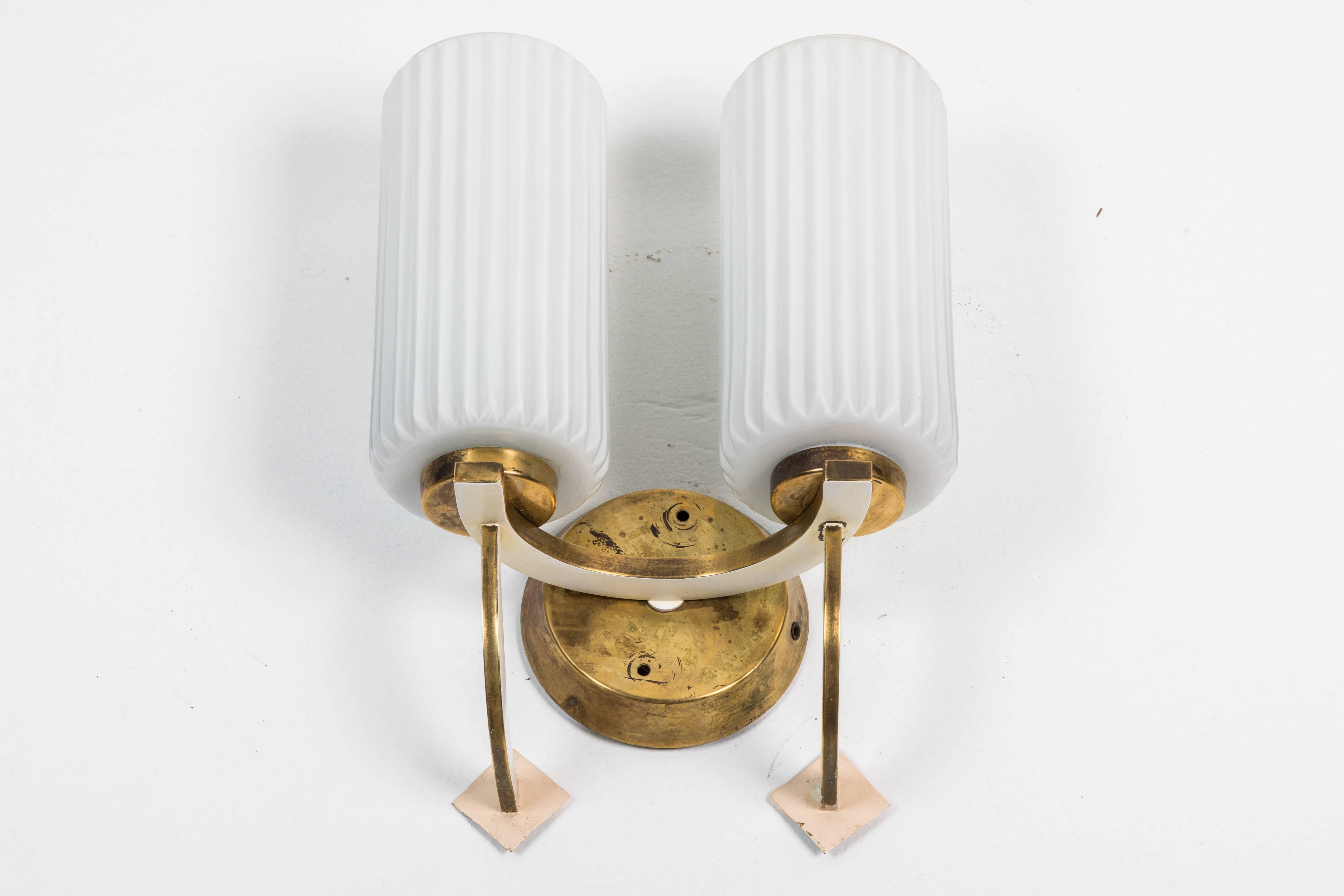 Midcentury double sconces in the manner of Stilnovo; two pairs available.