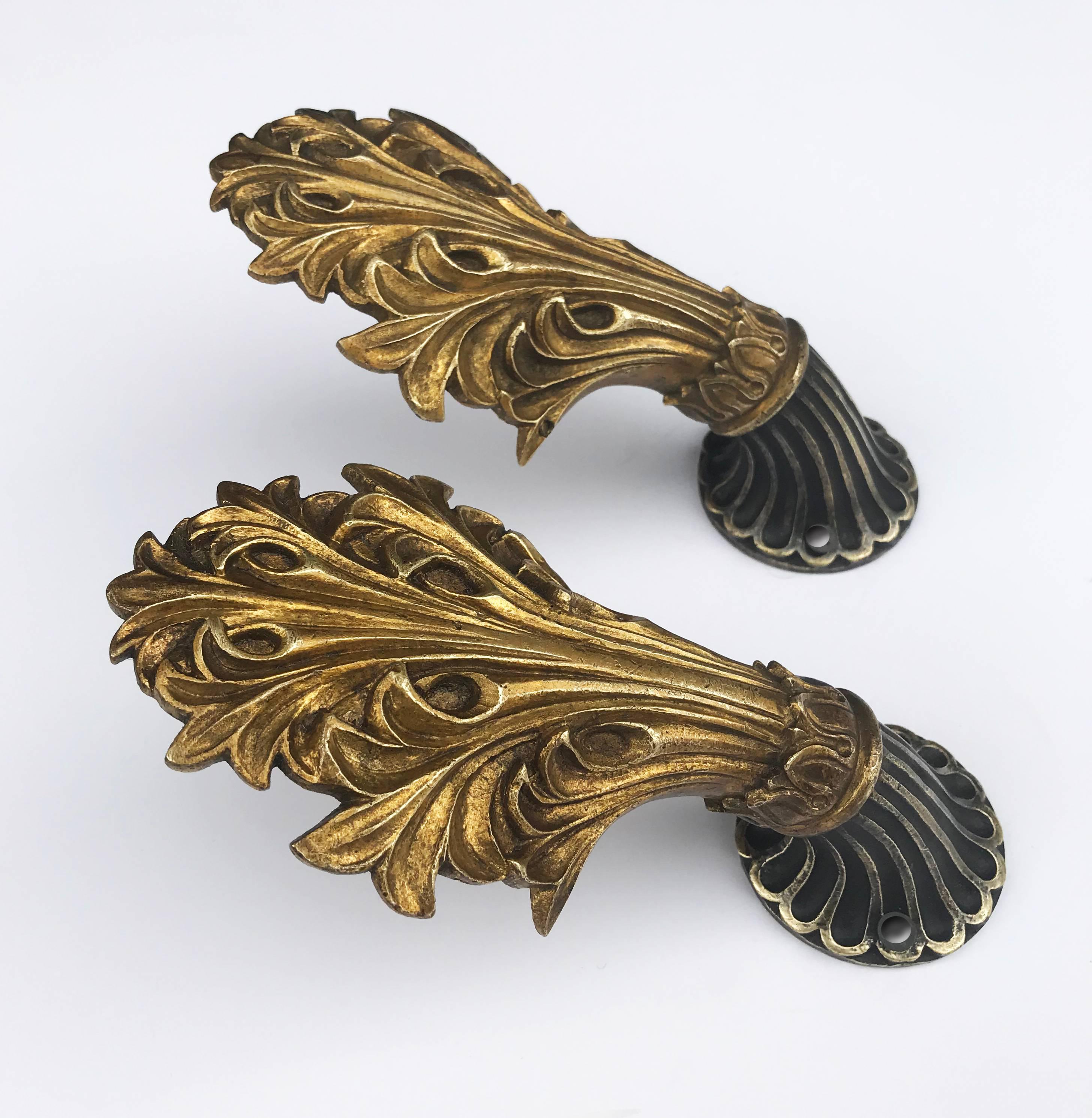 Intricate Victorian cast brass tiebacks. Can also be used as hooks.