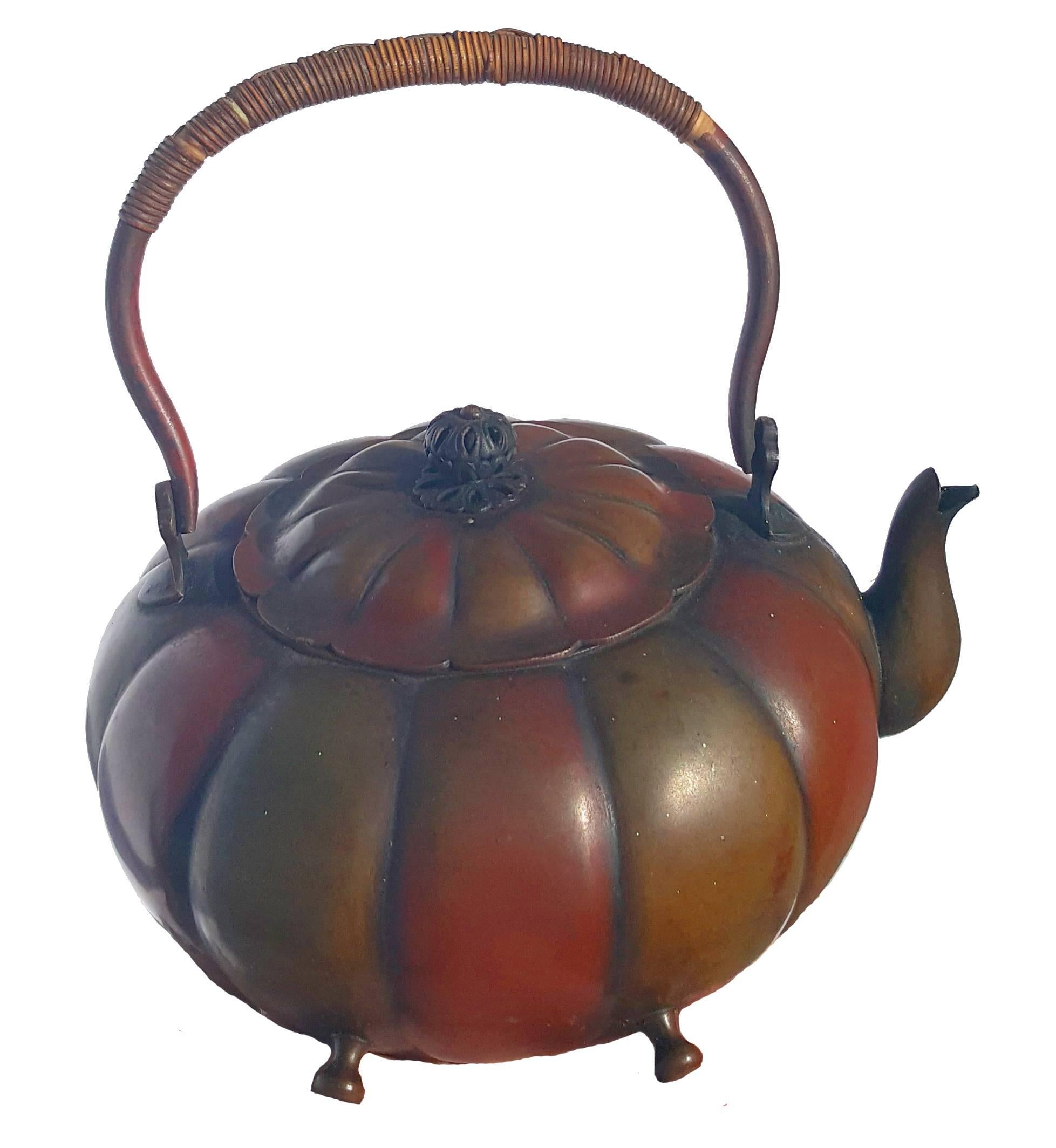 Chinese kettle and pedestal.