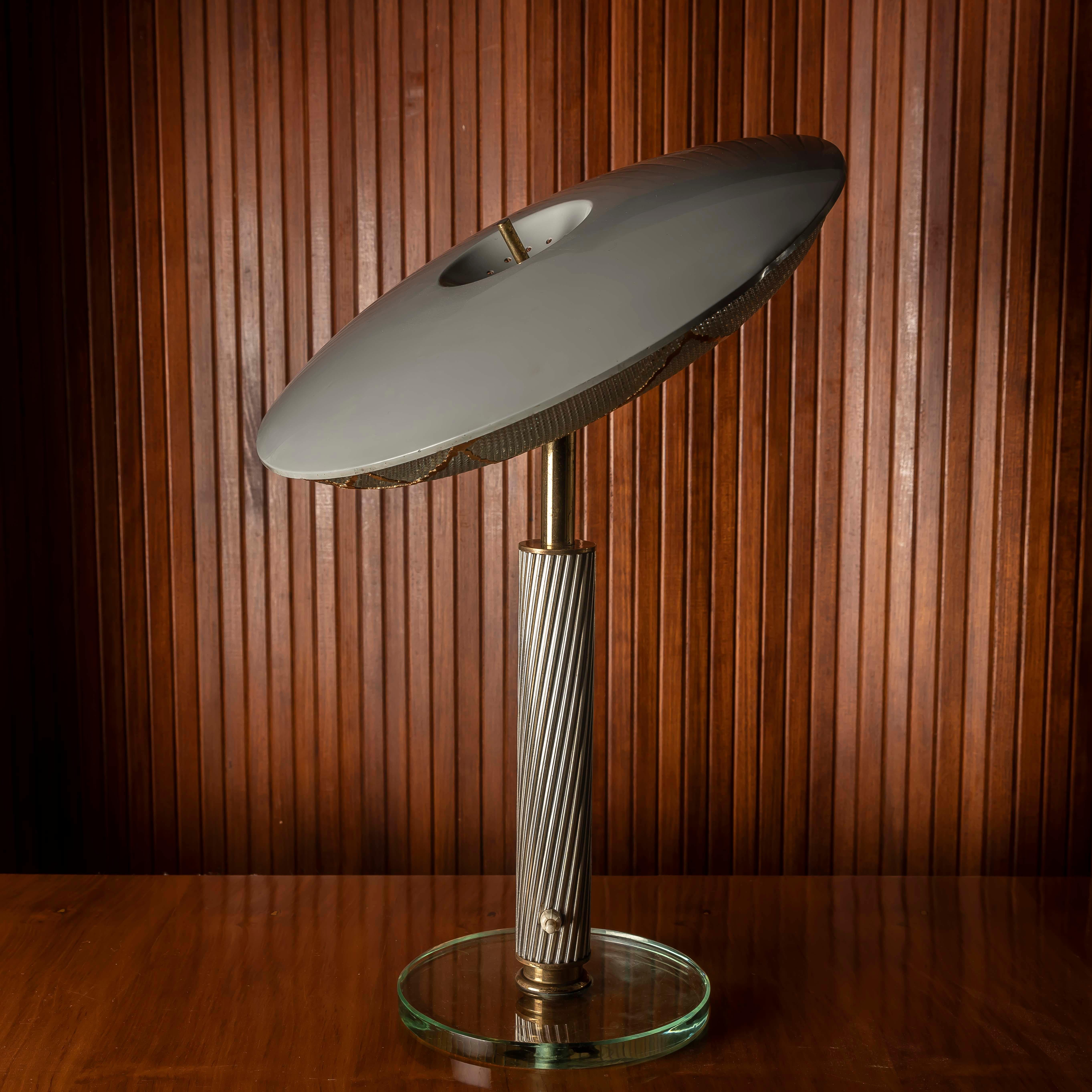 A rare and poetic table lamp designed by Pietro Chiesa (Milan, 1892–1948) for Fontana Arte, Italy, in the 1950s. This exceptional piece showcases the elegance of Italian mid-century design, crafted in glass, aluminum, and brass with refined