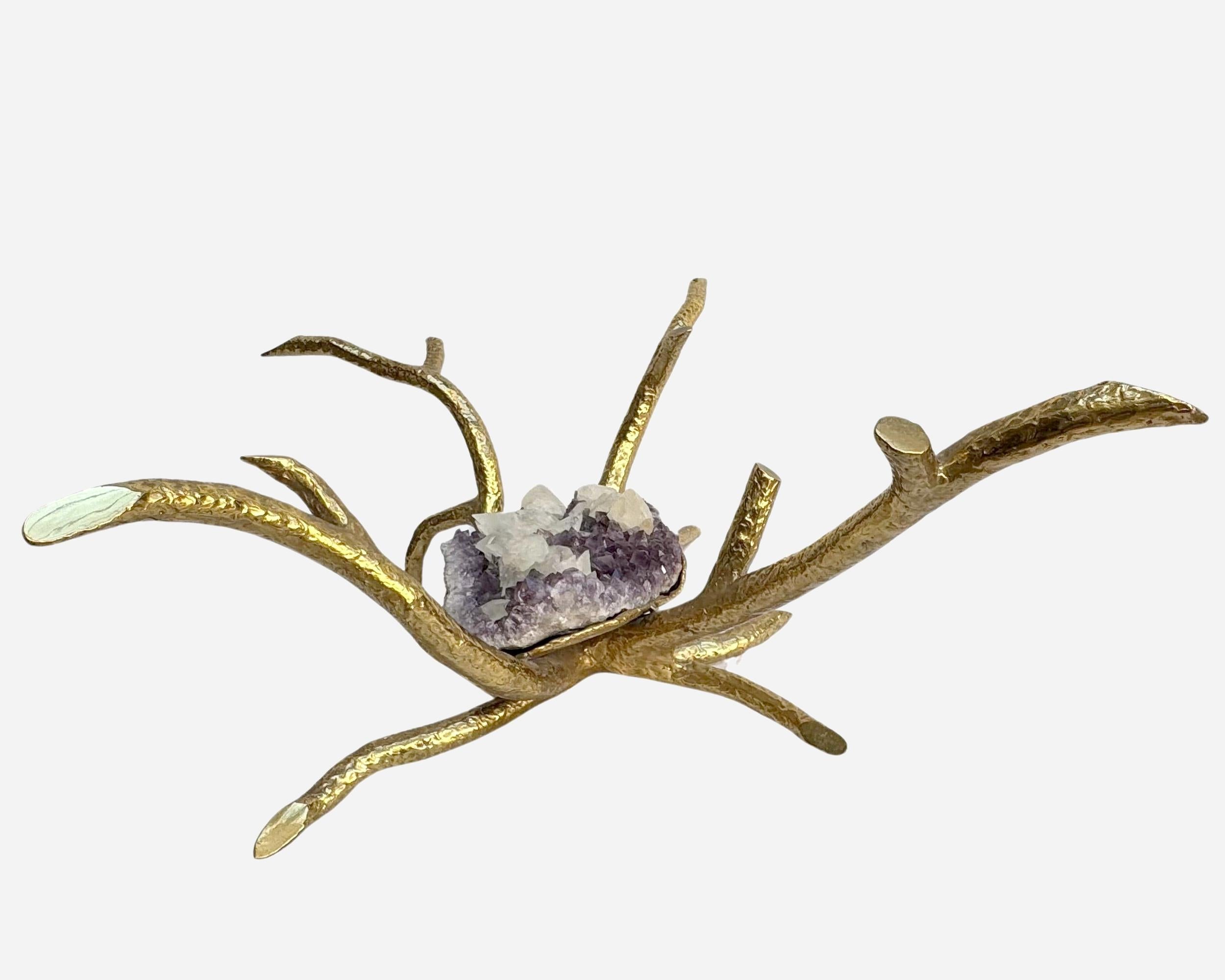 Beautiful coffee table in brazed brass, simulating two tree branches, with a rare Brazilian amethyst geode at its center, made unique by calcite blocks. These are a group of calcite crystals that later crystallized inside the amethyst geode, when