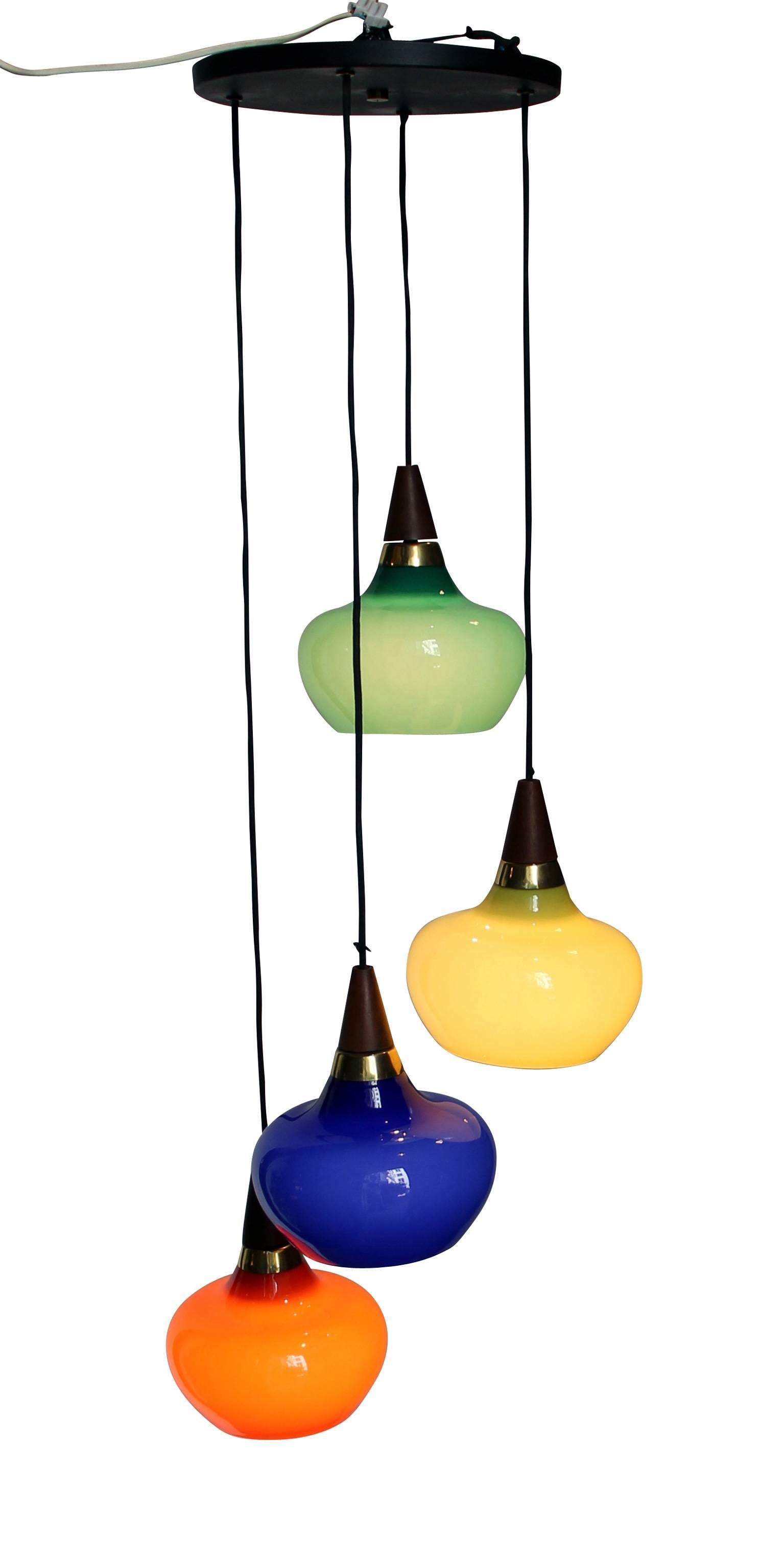 Interesting 1950s suspension in colored glass, wood and metal. In good original condition.