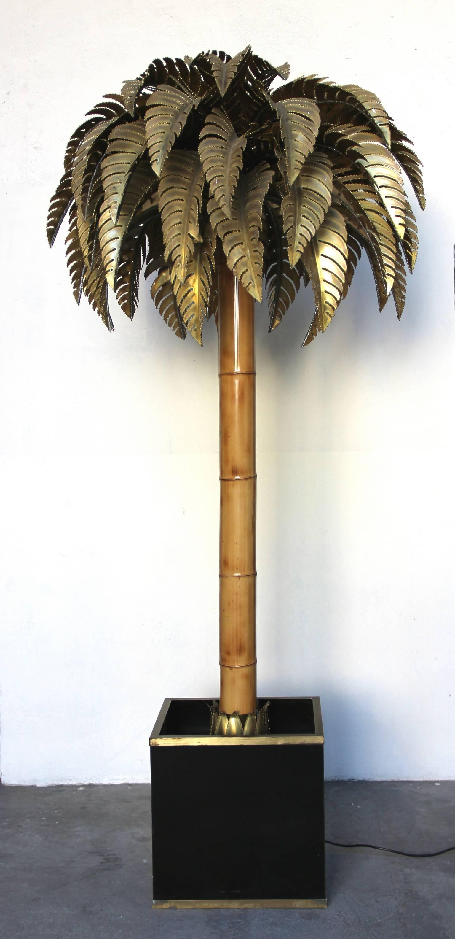 Palm tree floor lamp. Brass canopy and bamboo trunc, in a planter bordered with brass ledges.
 