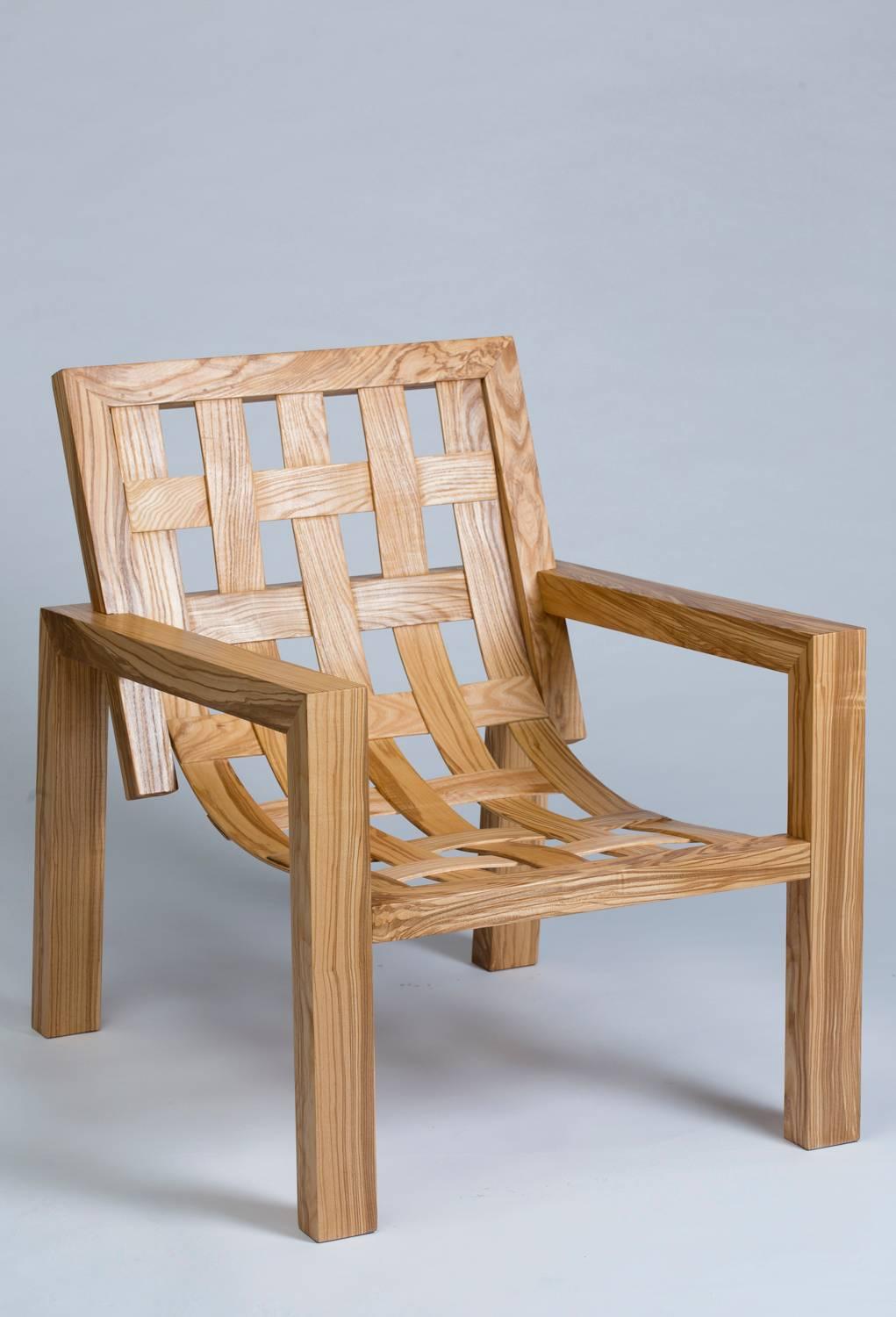 Two armchairs in solid ash-olive tree, seat and backrest in entrelaced wood.

Technical prowess and very neat manufacturing.
Made entirely by hand.