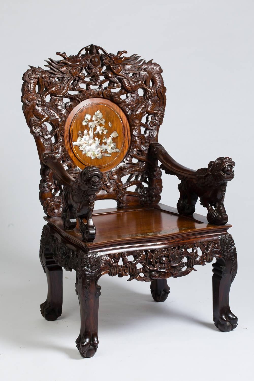 Four beautiful Indochinese armchairs in carved wood with numerous incrustations of mother-of-pearl engraved and re-ornamented.
