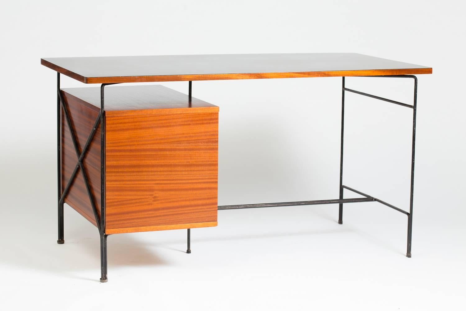 Writing table designed by Pierre Guariche.
Black lacquered metal structure, Mahogany veneered wood, wood tabletop with Formica in black.
With two drawers. Measurements of the drawer cabinet are 27.5 in X 16.9 in, 18.11 height.