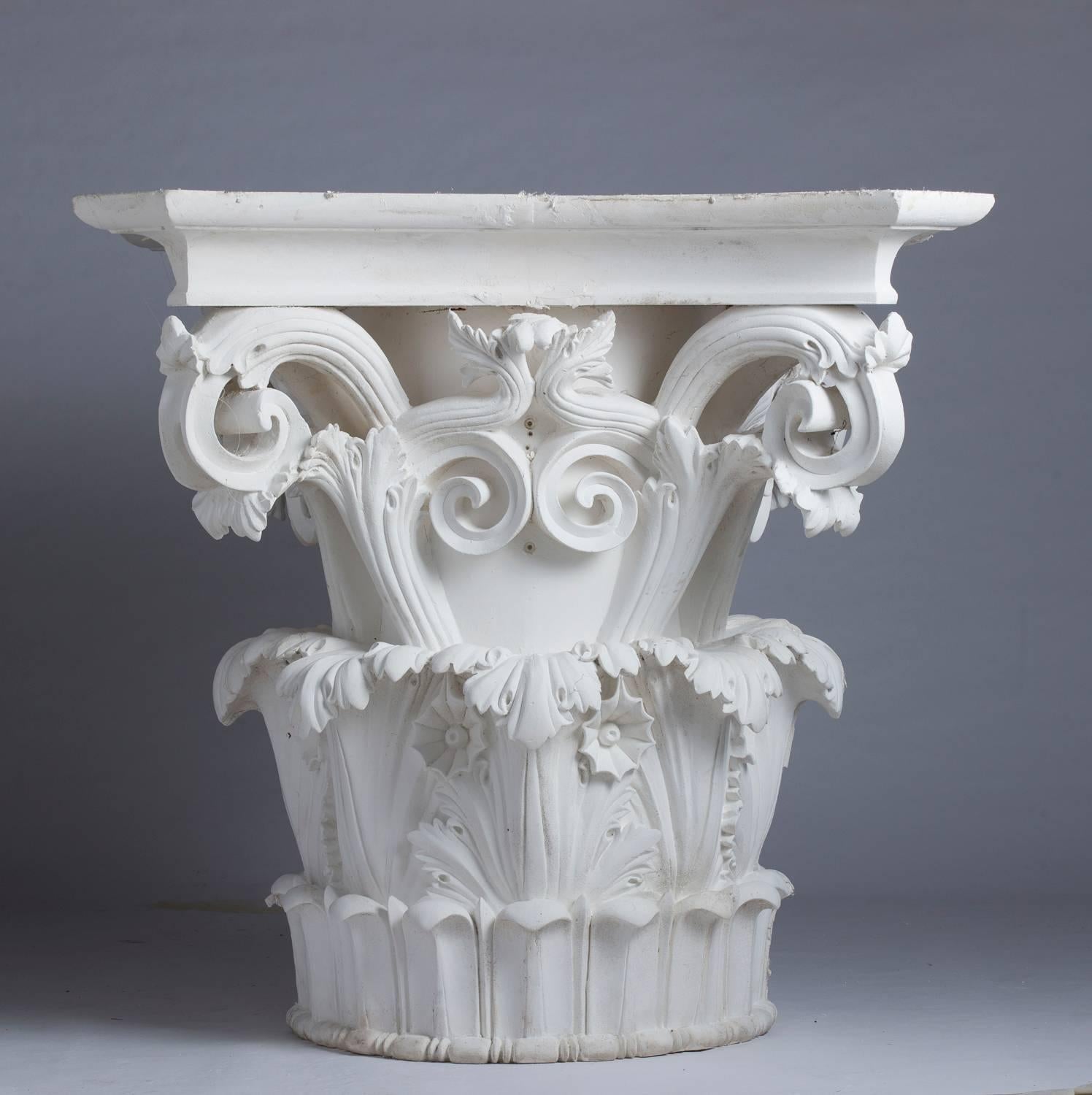 Four large Corinthian half-capitals in plaster that can constitute two whole capitals, by bringing them together two by two. Provenance: collection of models of workshop plasters.