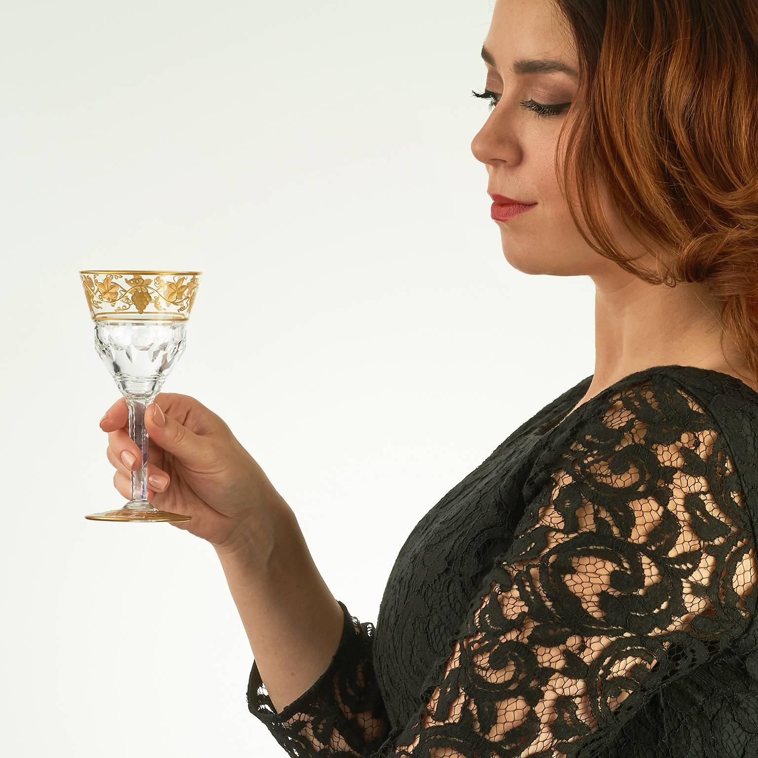 Val St. Lambert, Belgium, circa 1950s. These elegant “Pampre D’Or” pattern wine glasses from the renowned Belgian glass house Val St. Lambert are beautifully cut in and hand-gilded. The heavy crystal is decorated in a sublime version of the