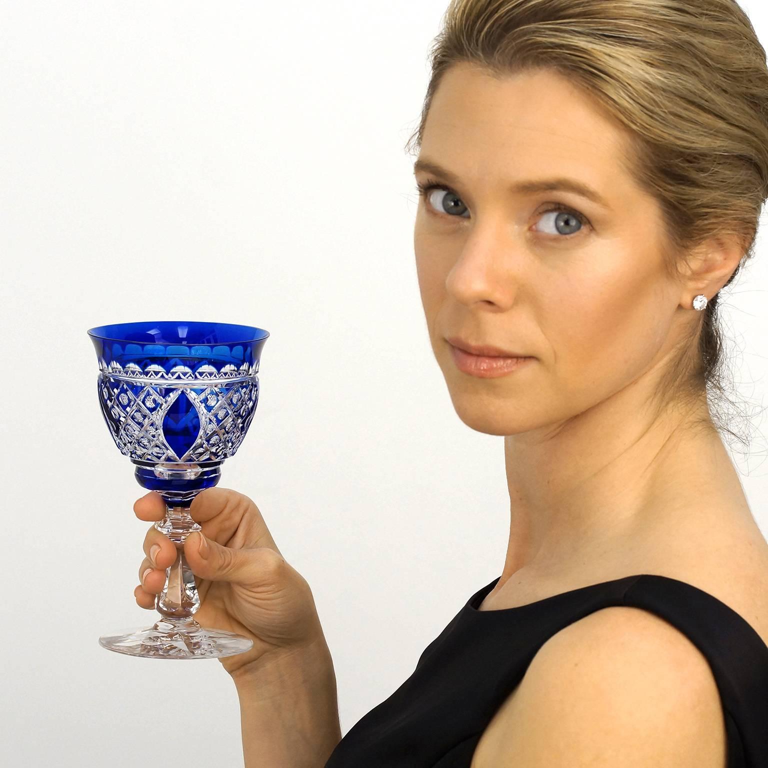 Circa 1930s, by Val St. Lambert, Belgium.  This set of 18 spectacular cobalt blue cut crystal water glasses by Val Saint Lambert of Belgium are superbly cut in a complex and rare pattern. The intense bright cobalt blue completes the visual