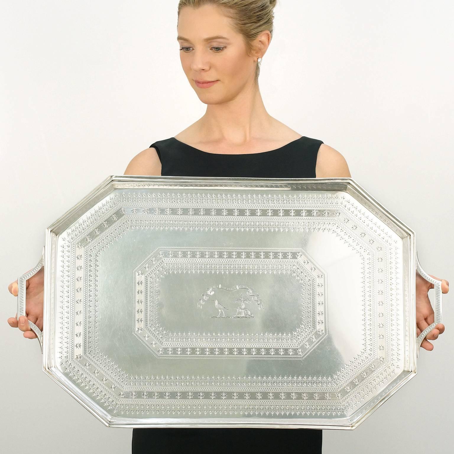 Circa 1884, sterling, by Edward Hutton, London, England. This tray's elegant octagonal form is the perfect foil for the superb hand-engraving that is the visual focus of this impressive piece of London sterling. Surrounded by rows of stars and