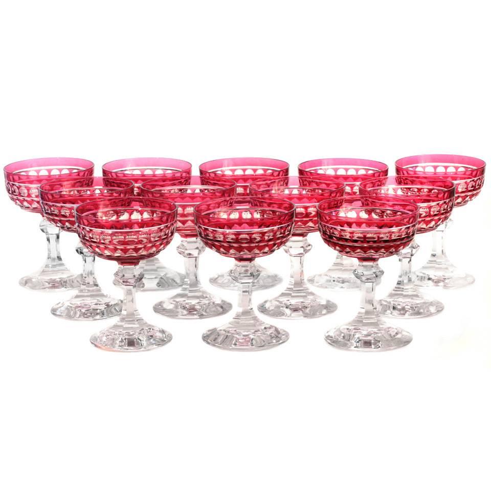 Val Saint Lambert, Belgium, circa 1920s. Set of 12. This set of twelve Val Saint Lambert champagne glasses will add the perfect pop of color to a fashionable table or festive occasion. They feature the traditional coupe form that is easy in the hand