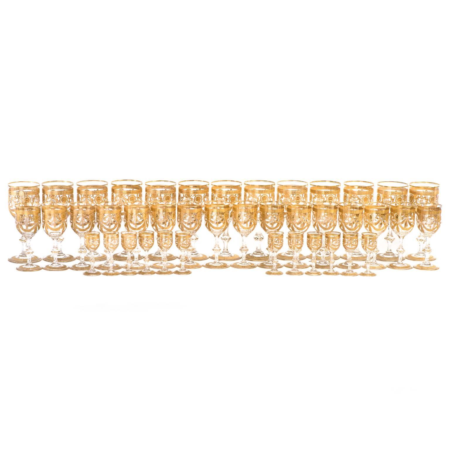 Circa 1910, St. Louis, France.  This set of magnificent Saint Louis crystal in the rare gilt Congress pattern is complete for twelve with extras. Comprised of 13 water goblets, 16 wine glasses, and 12 cordials, this pattern has long been