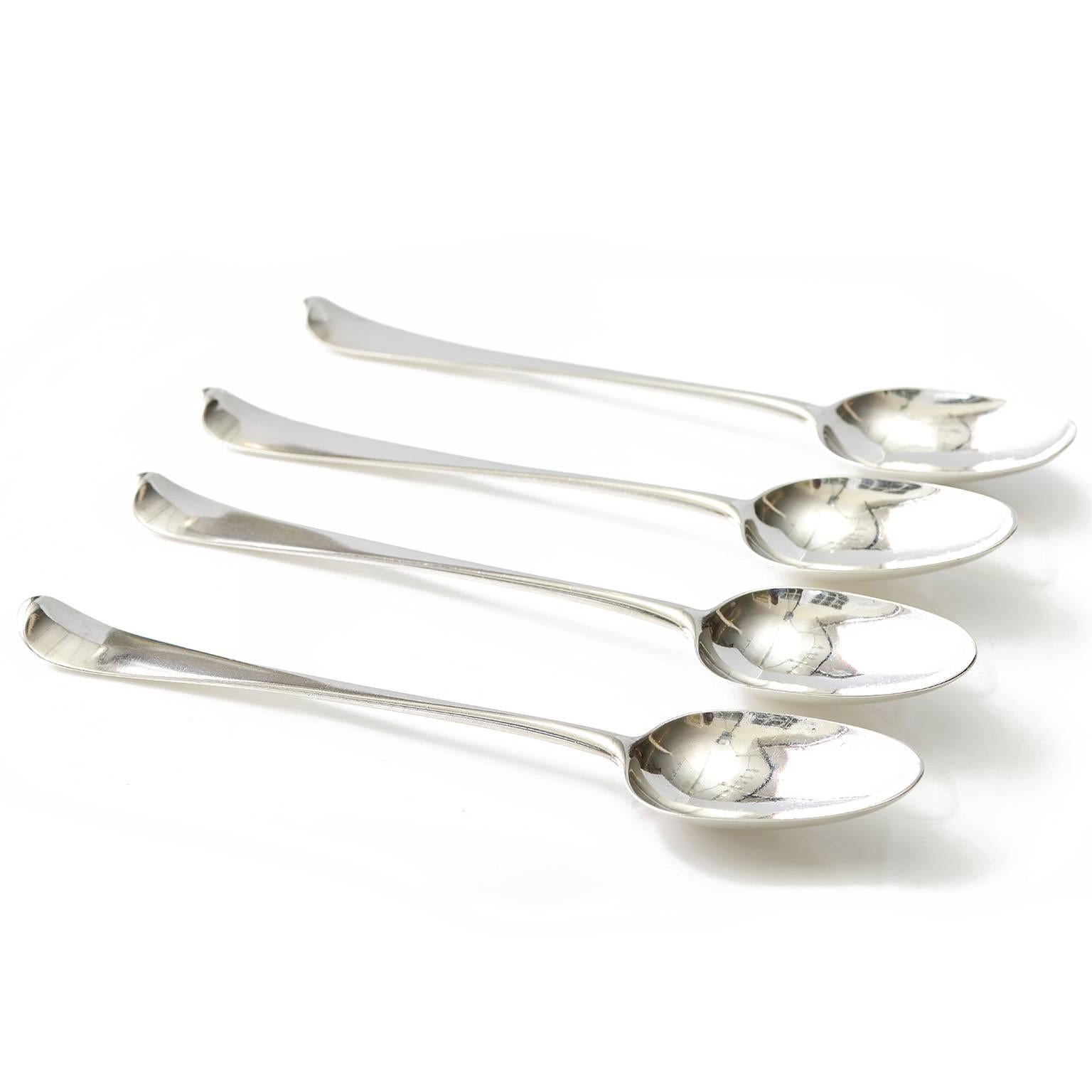 Circa 1750-51, Sterling, by Paul Callard, London, England. This classic set of four sterling basting or stuffing spoons by Paul Callard features sleek Georgian styling and superior London quality. Over 250 years old, they add decorative gravitas to