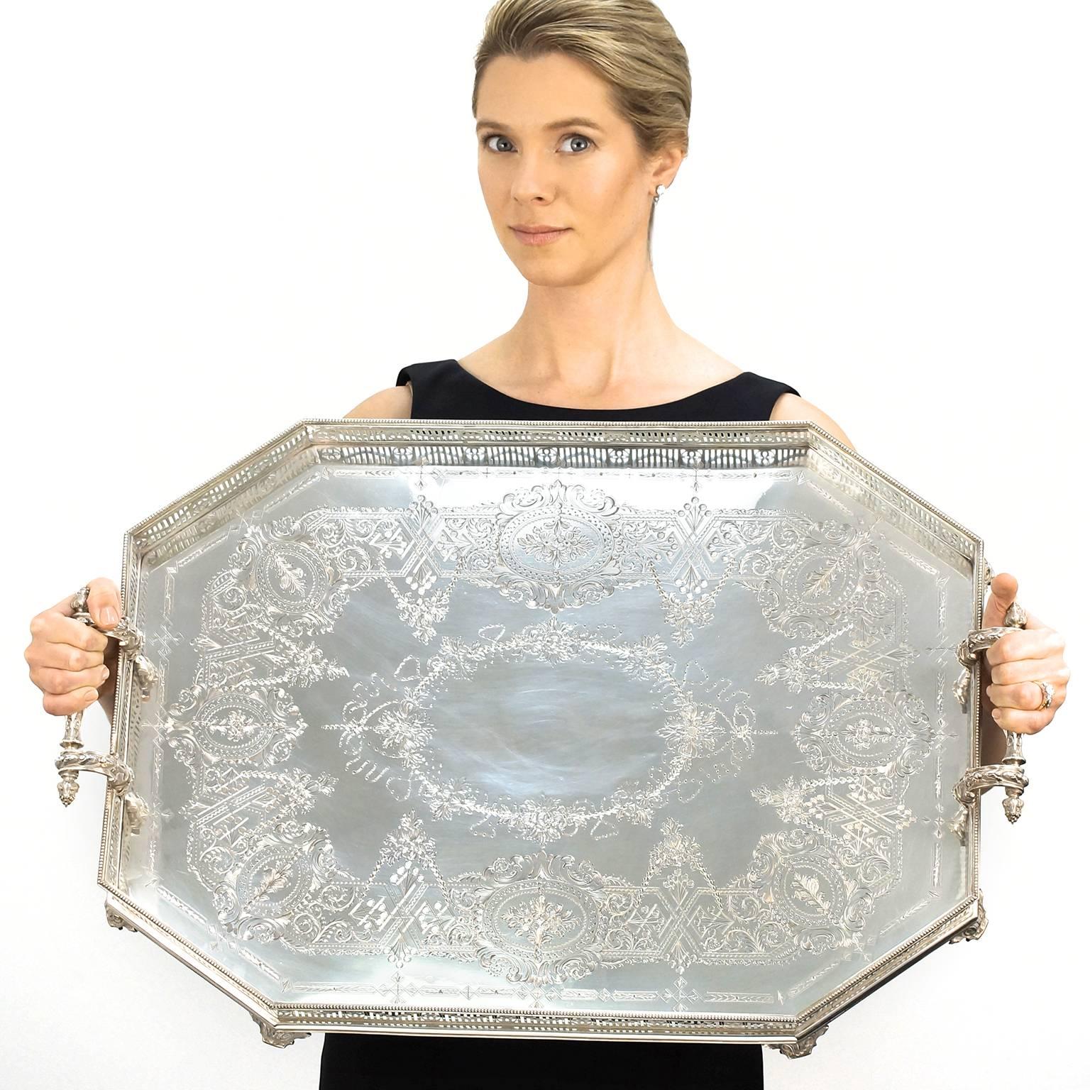 Circa 1896, Sterling, by Martin and Hall of Sheffield, England.  This tray is an absolutely brilliant example of late Victorian British sterling. It has it all - classic good looks, massive size and weight, octagonal form, superb engraving, solid