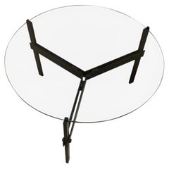 Mesa de centro de Mathieu Mategot en hierro latonado y cristal del siglo XX.