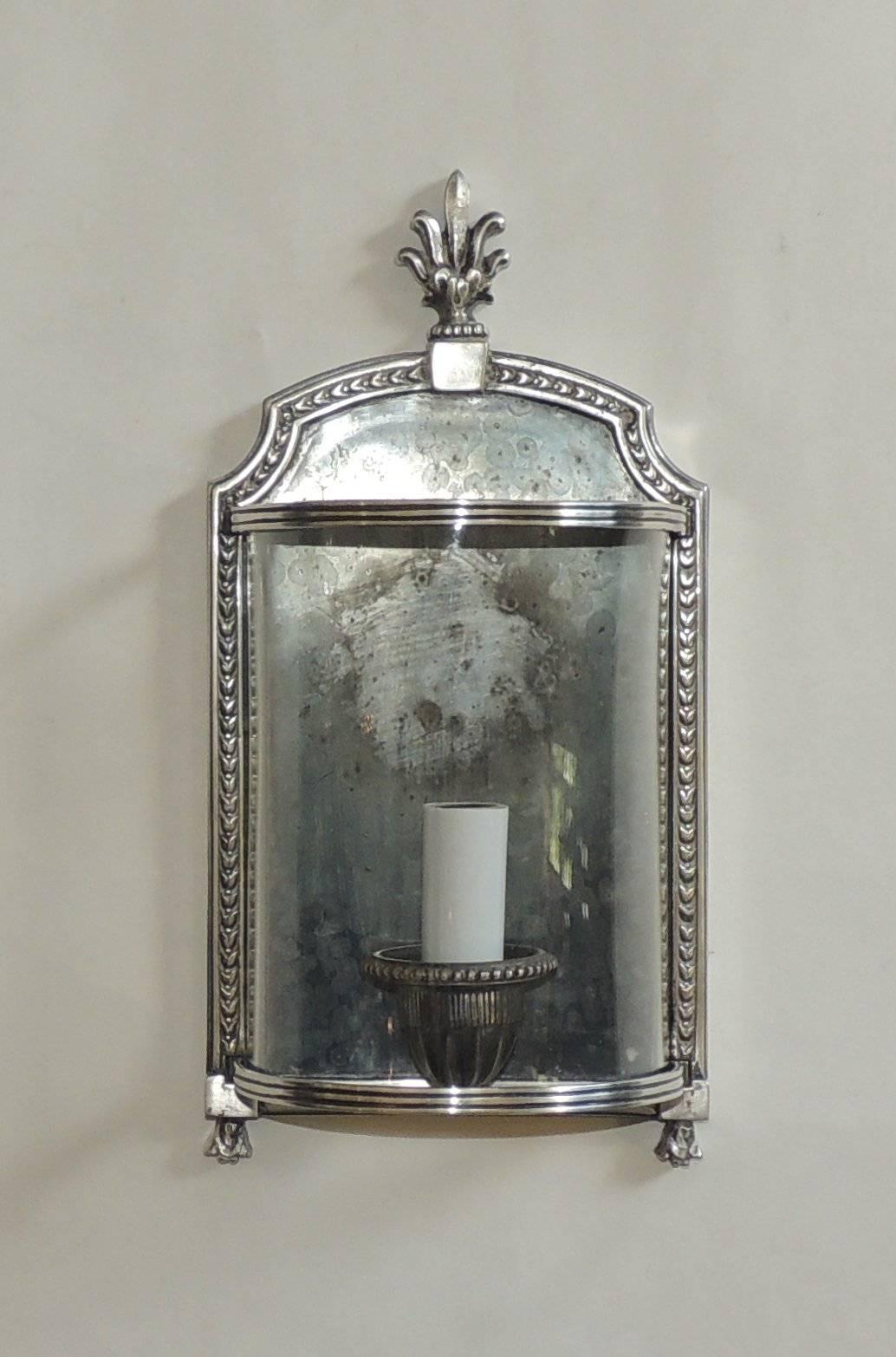 Wonderful pair of silvered bronze nickel antique plated curved glass 
E.F. Caldwell wall sconce light fixtures in the regency / neoclassical style.