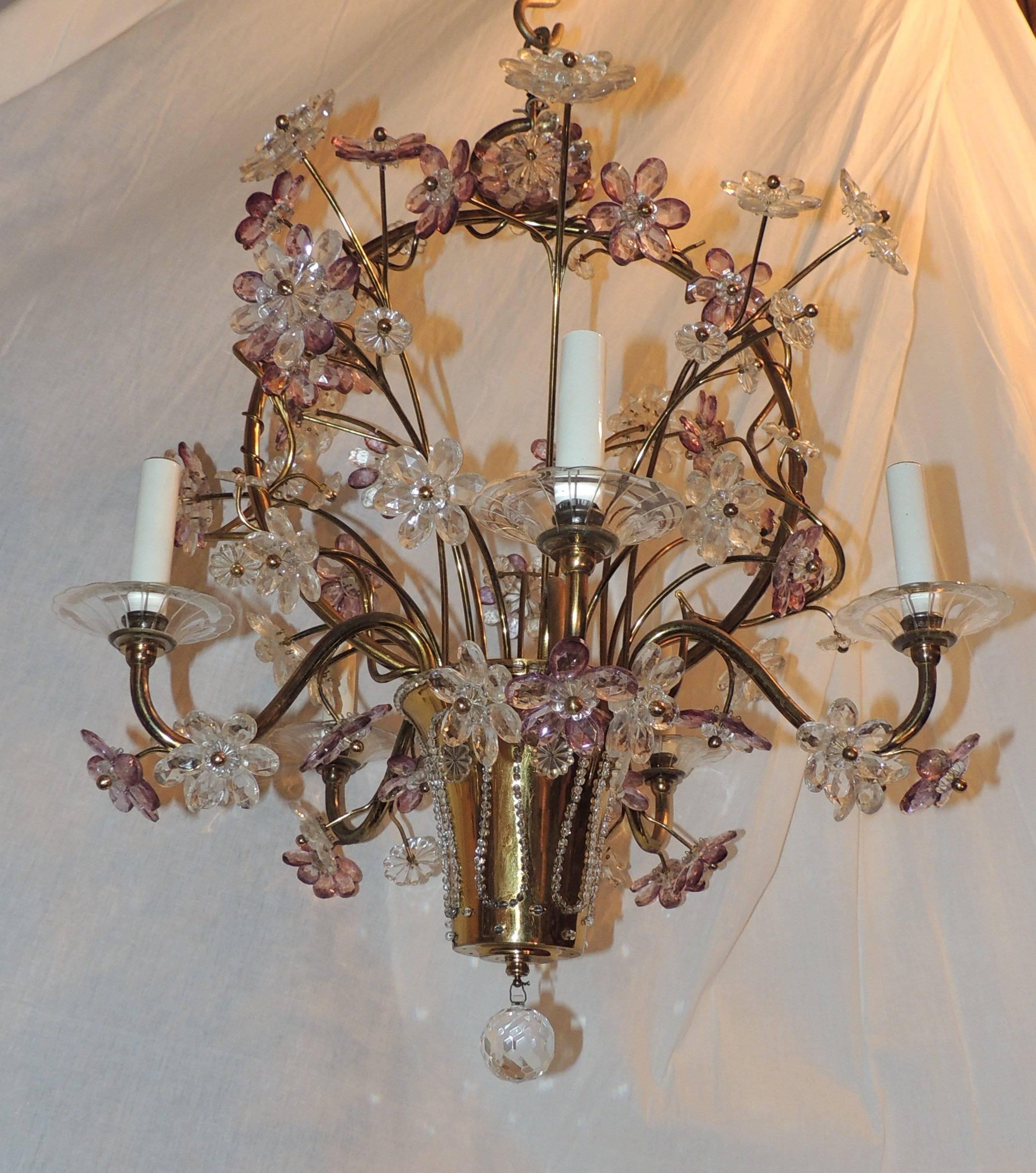 Wonderful chandelier with gilt bronze basket which is filled with amethyst and crystal flowers. The flowers also are entwined around the handle and through the five arms. The basket is wrapped with crystal beads and a cut crystal prism finishes this