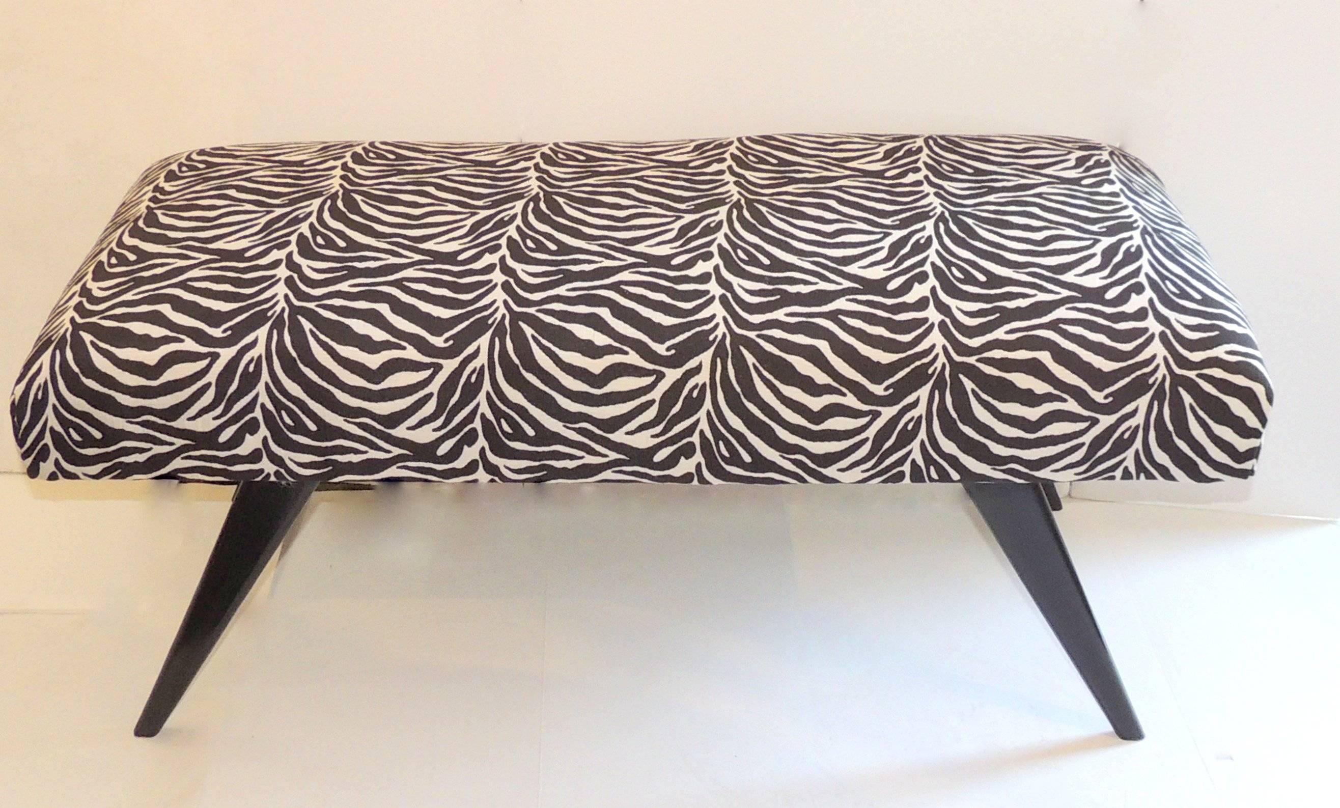 A wonderful sleek pair of black lacquered benches with zebra pattern upholstery. In the style of Jansen Mid-Century Modern.
Attributed to Jacques Tournus.
Measures: 17.5