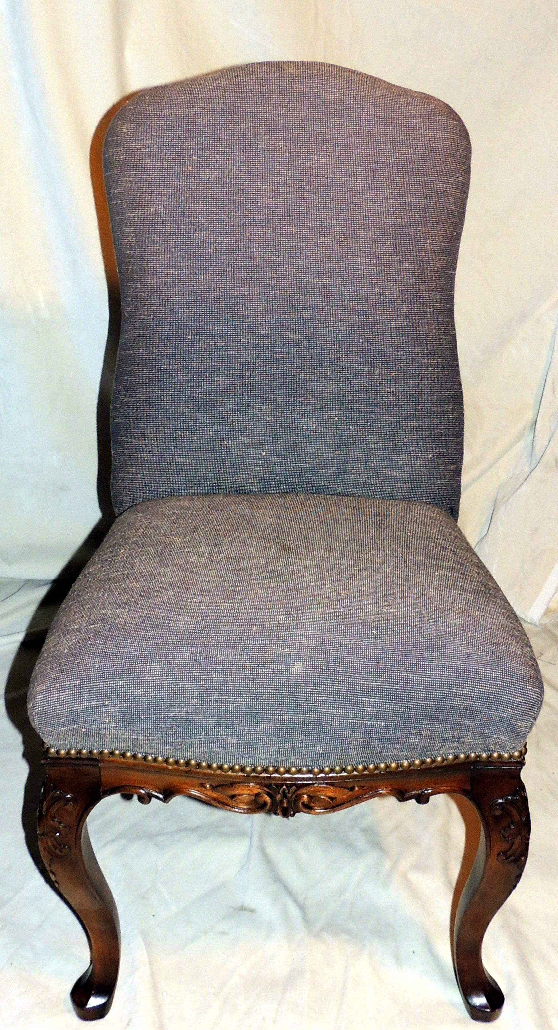 The two armchairs have straight back, scrolled carved arms, nail trim throughout.
The matching side chairs have curved back and nail trim throughout.

 Measures:
Armchairs: 22