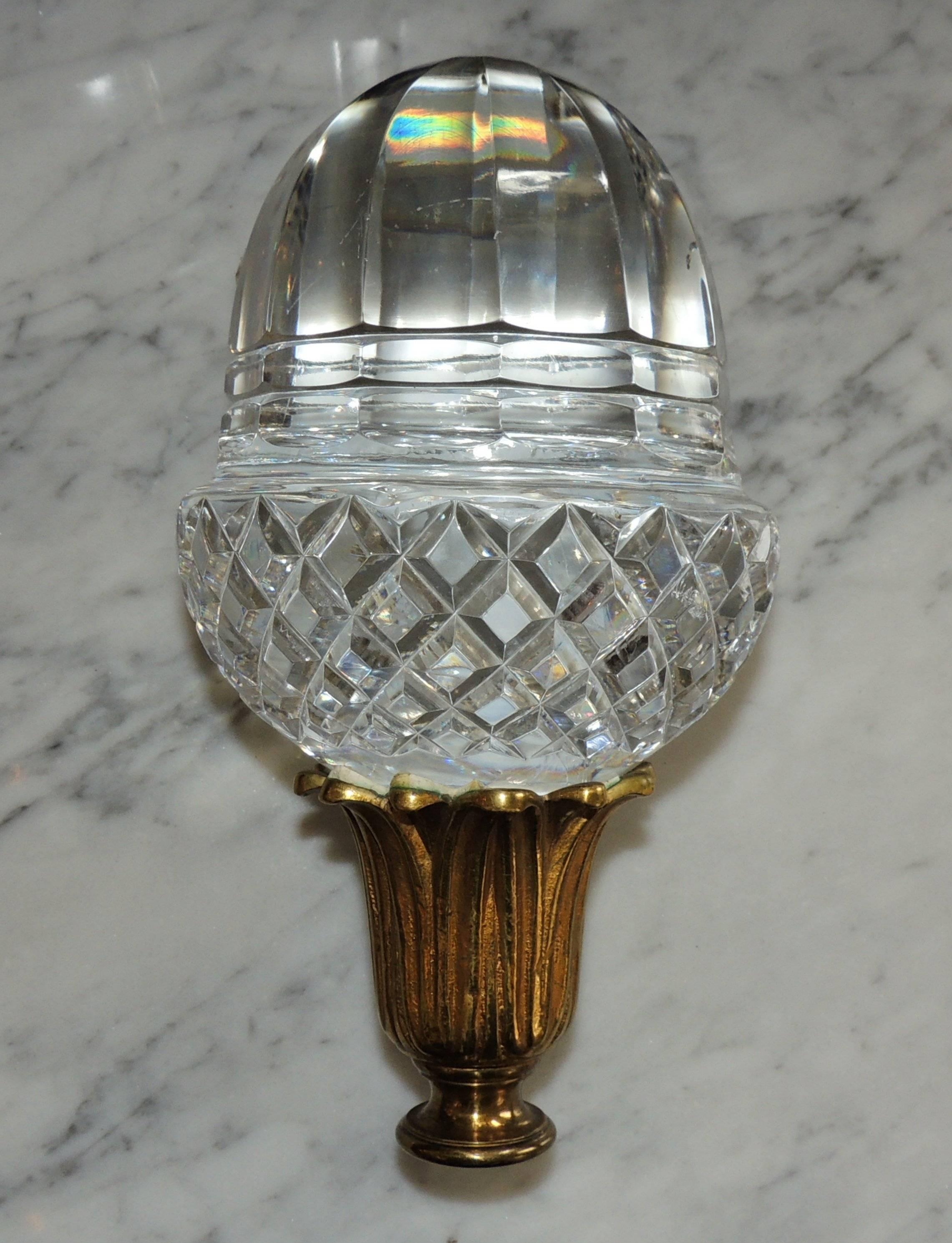 A wonderful antique crystal finial for the top of a banister cap or newell post on your staircase.

Cut crystal diamond pattern on the bottom, beveled edges and large clear crystal top. The bottom is a wonderful doré bronze leaf cup pattern. The