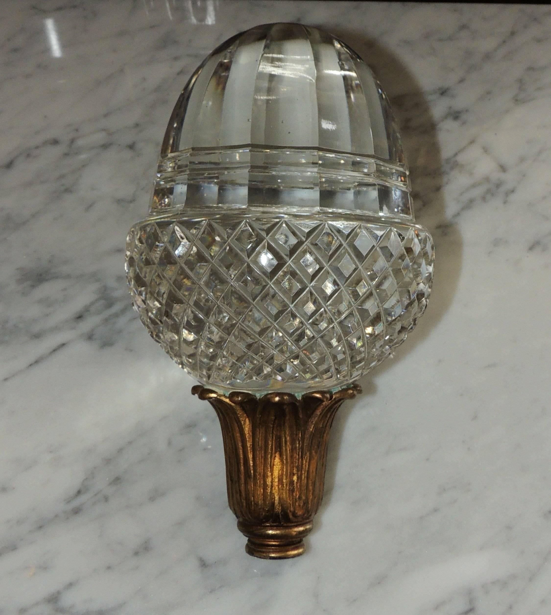 A wonderful extra large vintage crystal finial for the top of a banister cap or newell post on your staircase.

Cut crystal diamond pattern on the bottom and large clear beveled crystal top.
The bottom is a wonderful doré bronze leaf cup