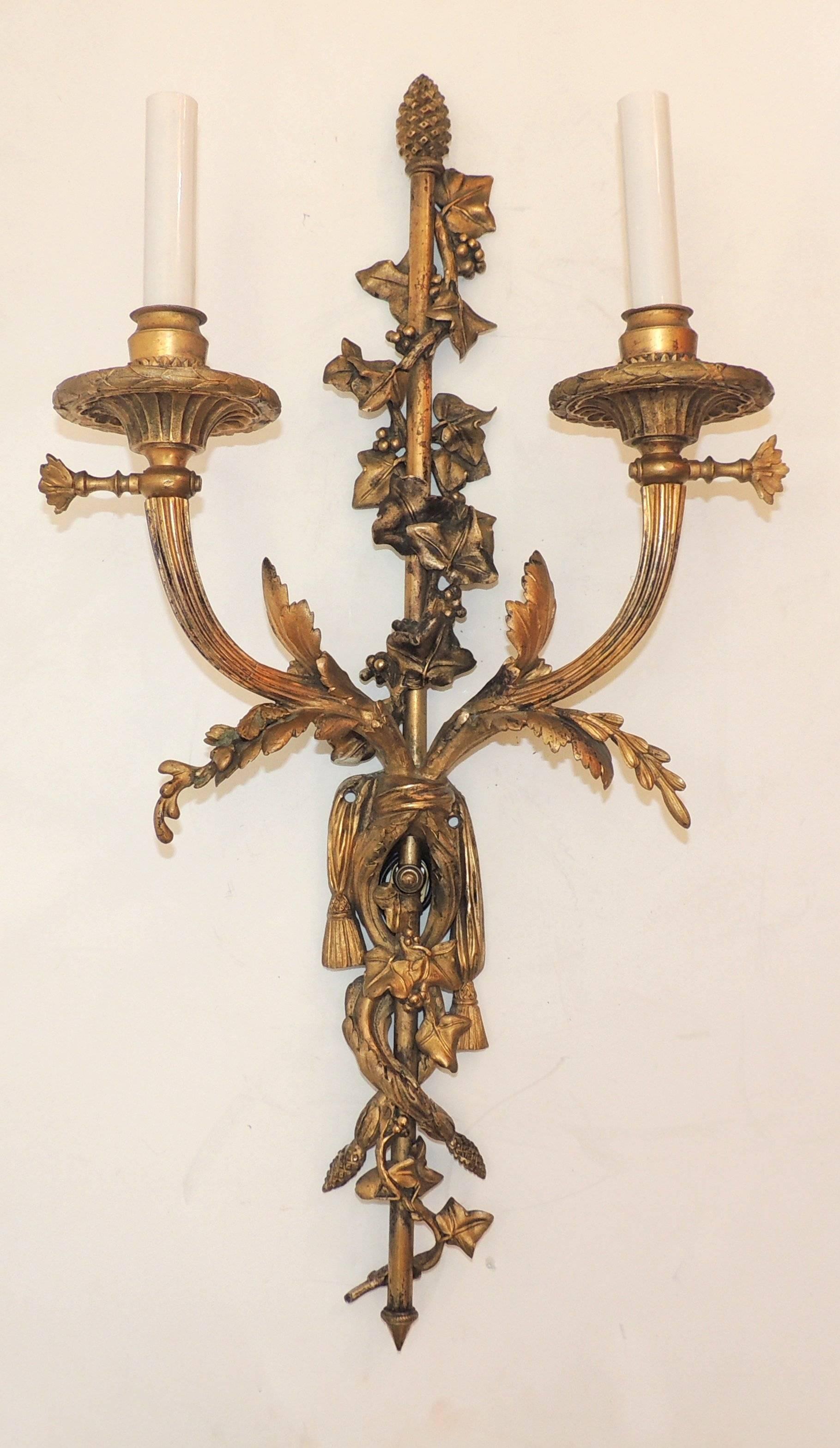 Outstanding quality pair of two-arm French, ribbon and tassel sconces Once Gas.

Measures: 23' H x 12" W.