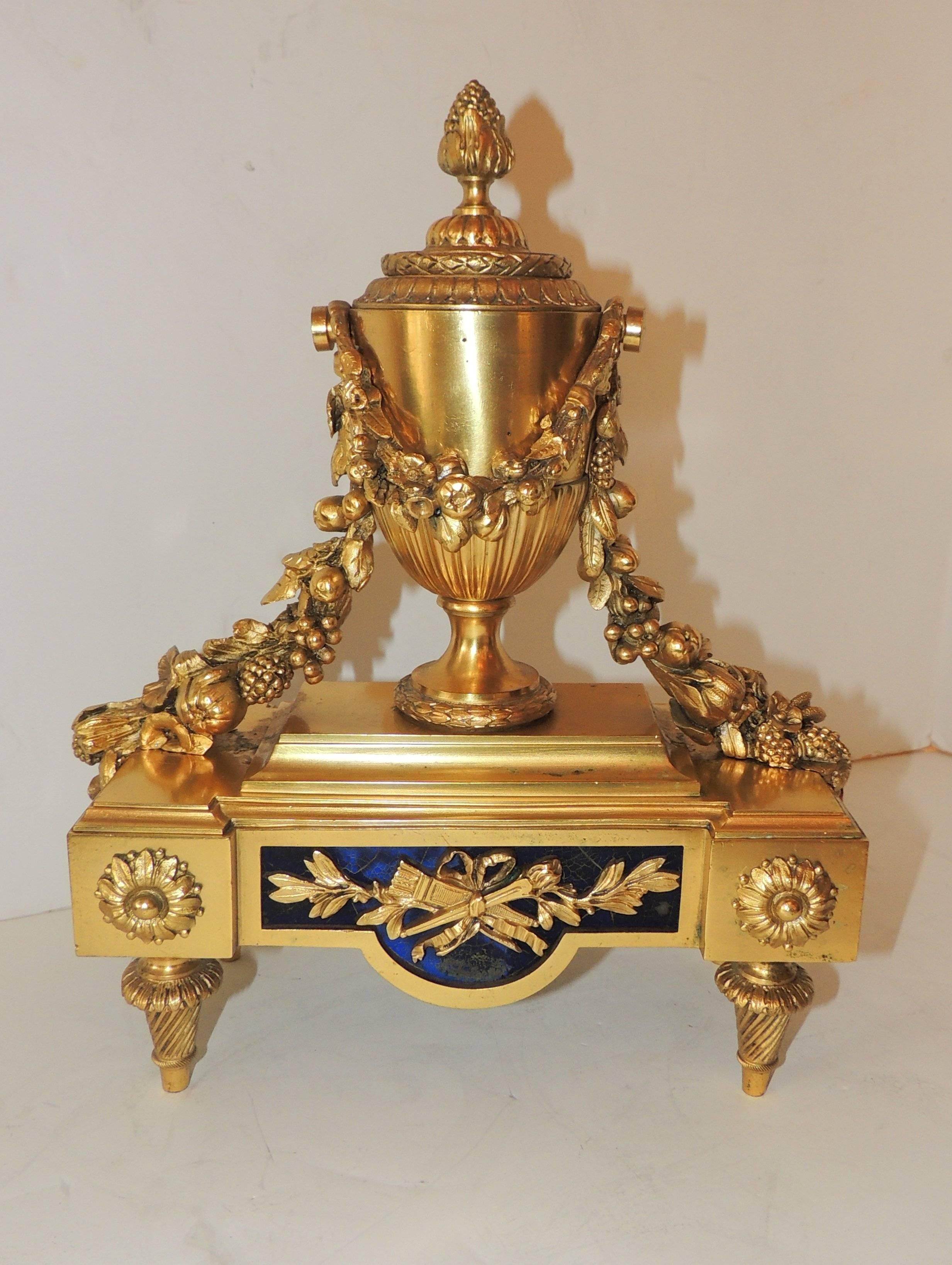 Wonderful French Pair Regency Empire Dore Bronze Chenets Urns Swag Andirons

Measures: 10.5" W x 14" H x 5" D.
  