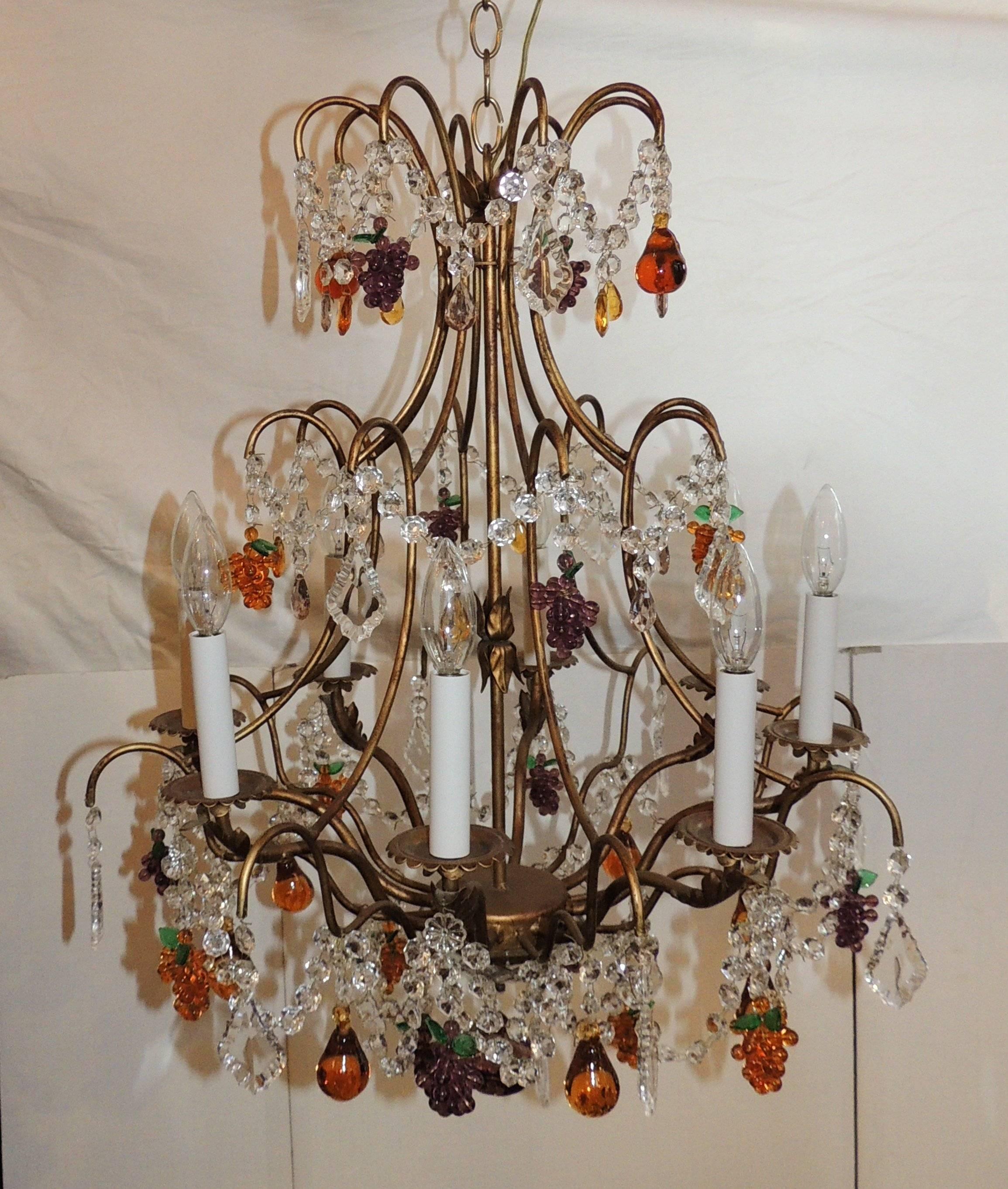 Wonderful Venetian colorful fruit eight-light chandelier with draped crystal beads and beveled edged pendants accenting the lights. 

Measures: 24