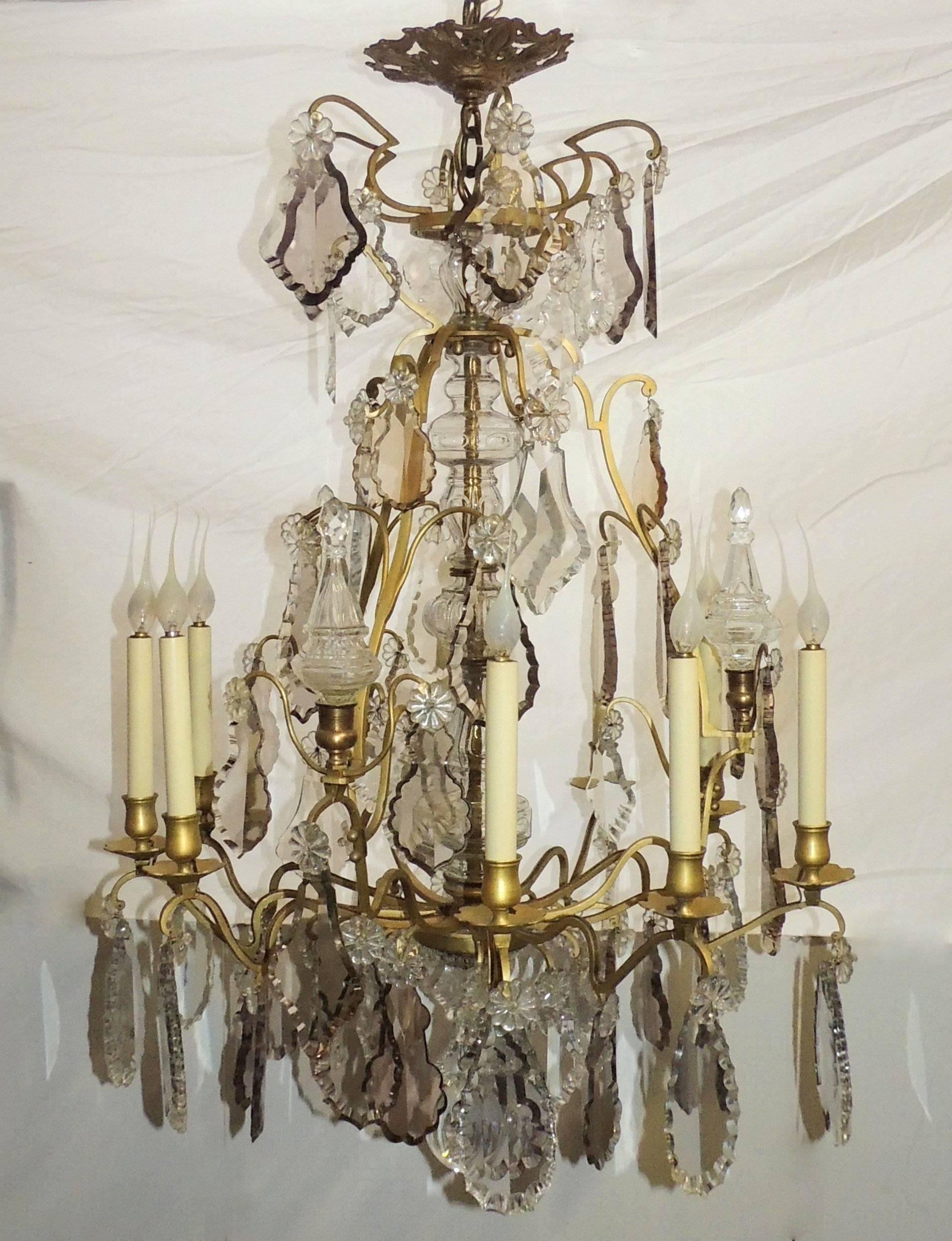Wonderful French gilt bronze beveled smoke crystal obelisks nine-light chandelier. 
Measures: 38