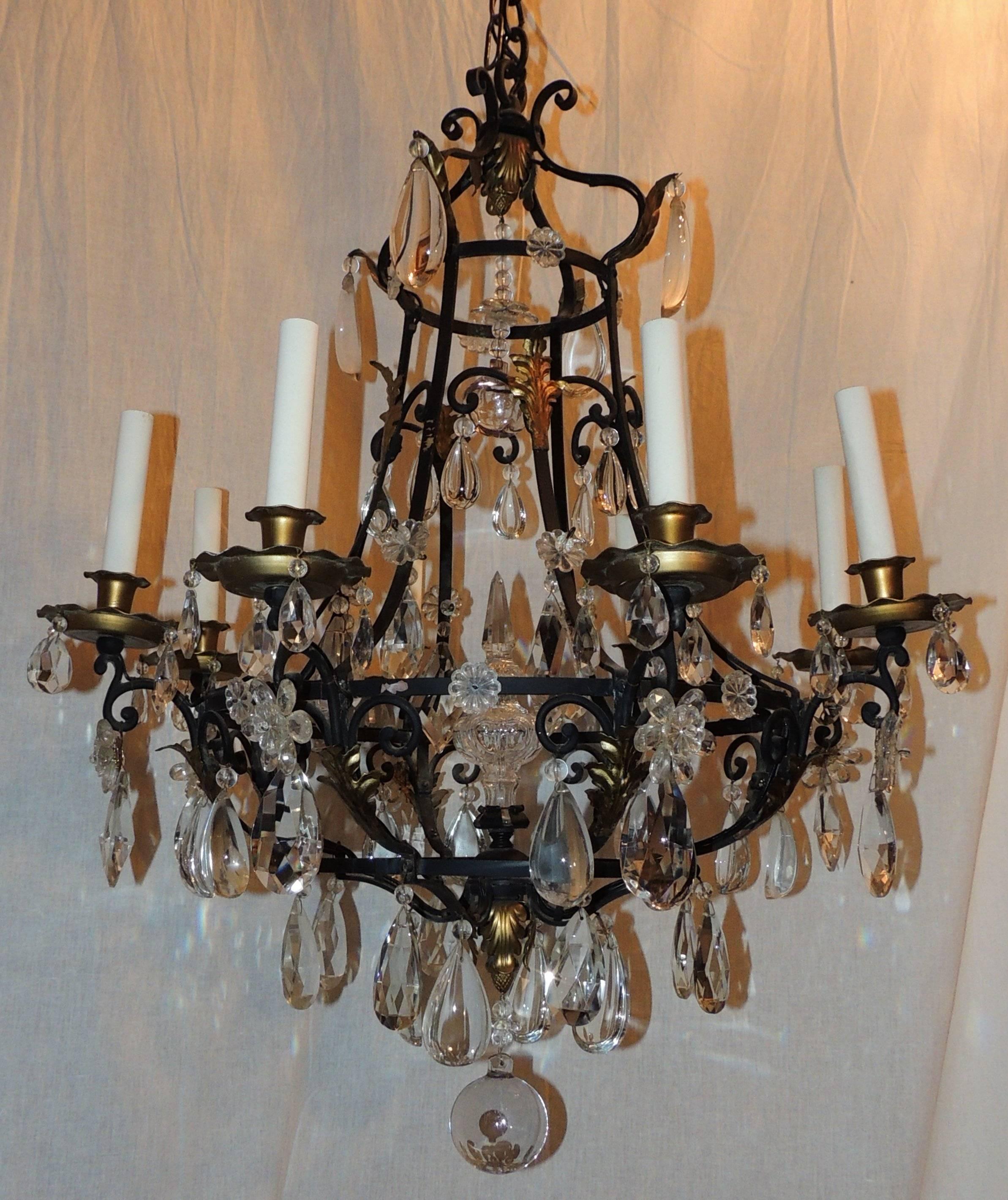A Wonderful French wrought iron Gold gilt crystal obelisk Center chandelier With scroll Work  In The Manner Of Bagues.

Measures: 33