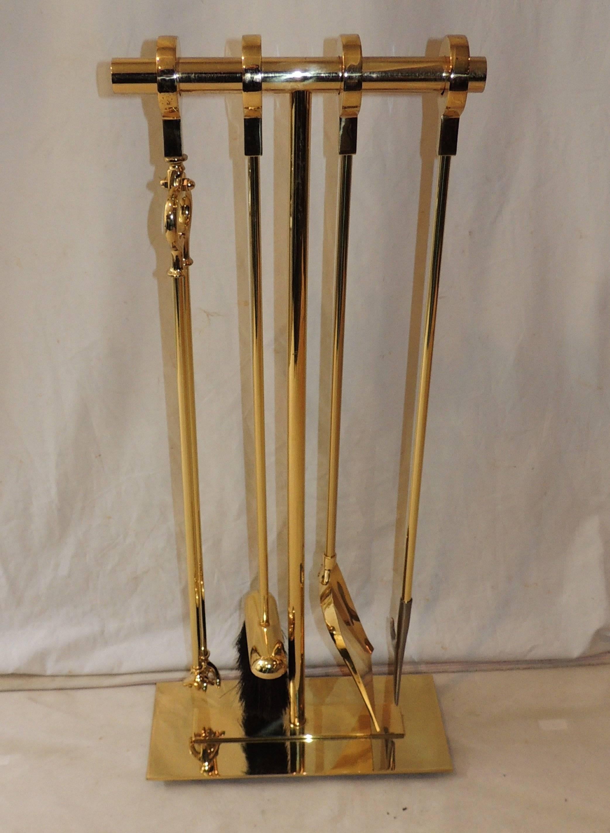 Wonderful Mid-Century Modern bronze five-piece fire place tool set brass stand. 
Includes: Stand, broom, shovel, pick, tongs.

Measures: 31.5